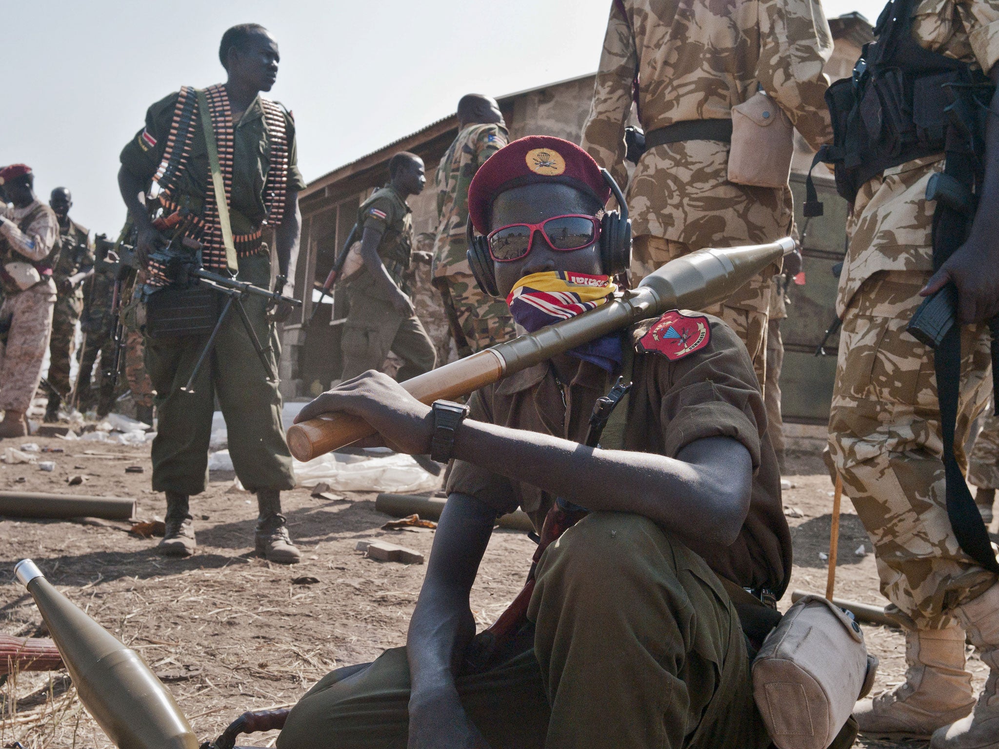 South Sudanese government soldiers wait to board trucks and pickups; a cessation of hostilities agreement in Addis Ababa that should at the least put a pause to five weeks of warfare has been reached