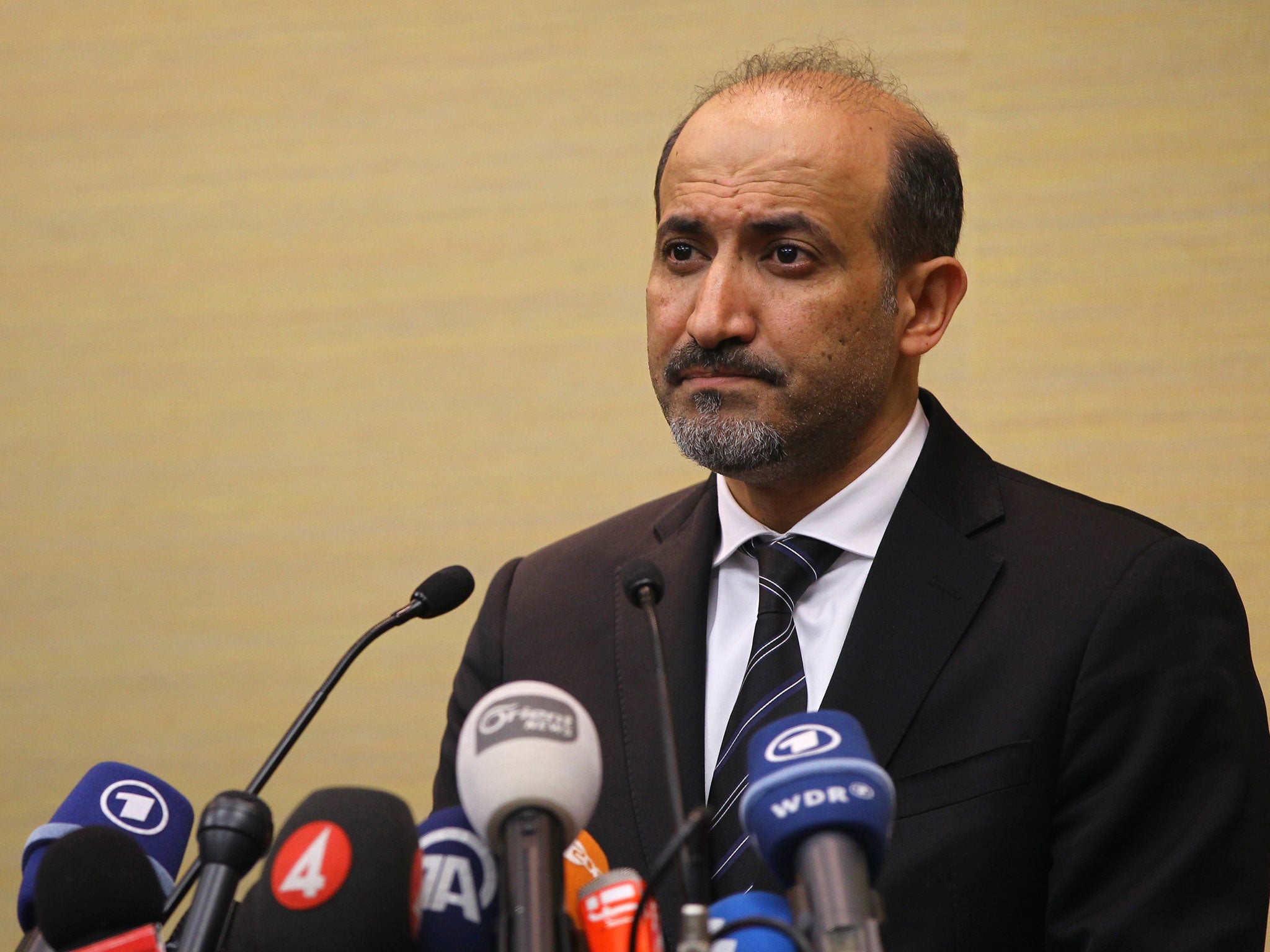 Ahmad al-Jarba, leader of the Syrian National Coalition (SNC), speaks to the press in Geneva, Switzerland