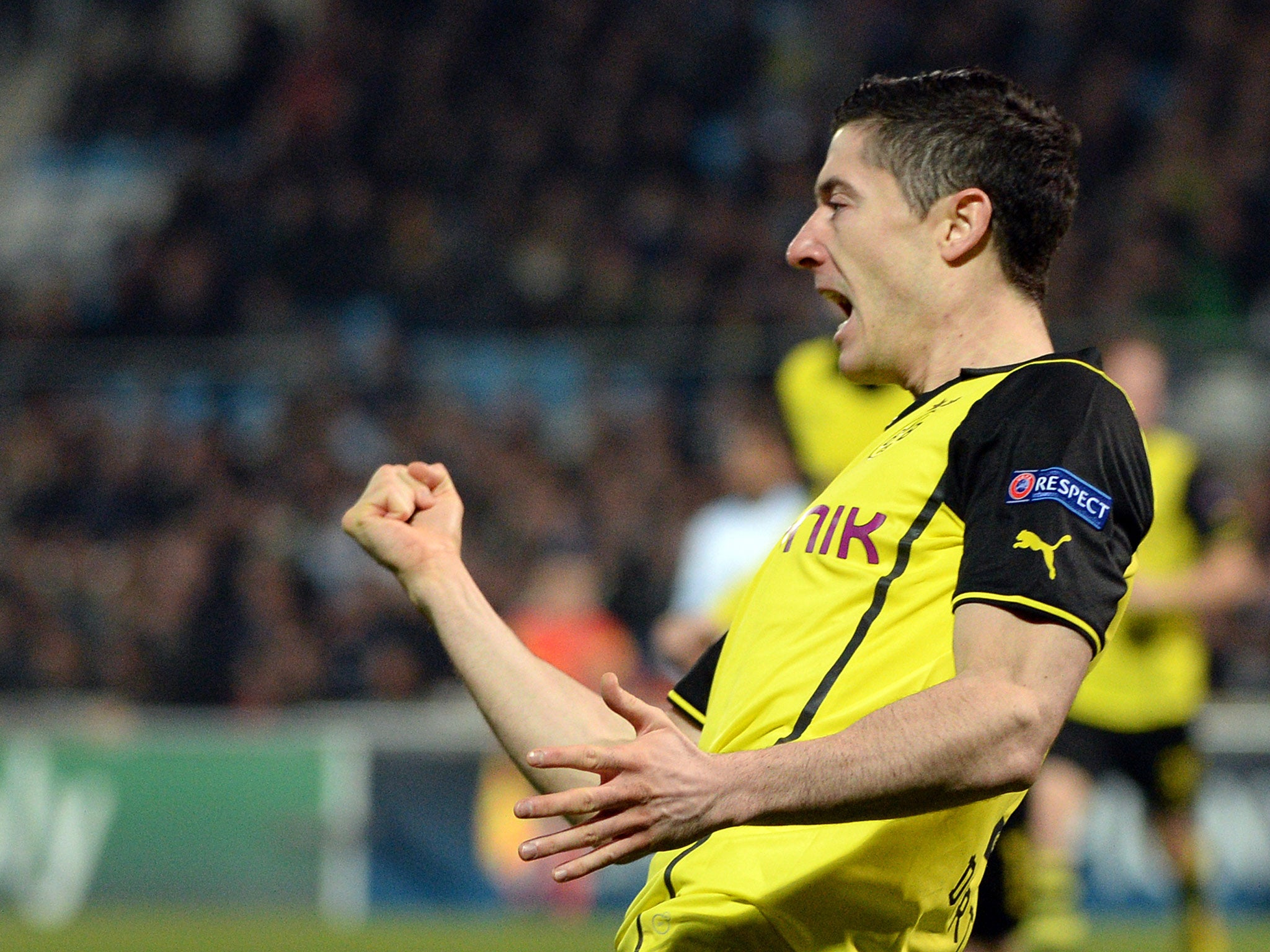 Robert Lewandowski celebrates scoring for Borussia Dortmund before he left for Bayern (Getty)