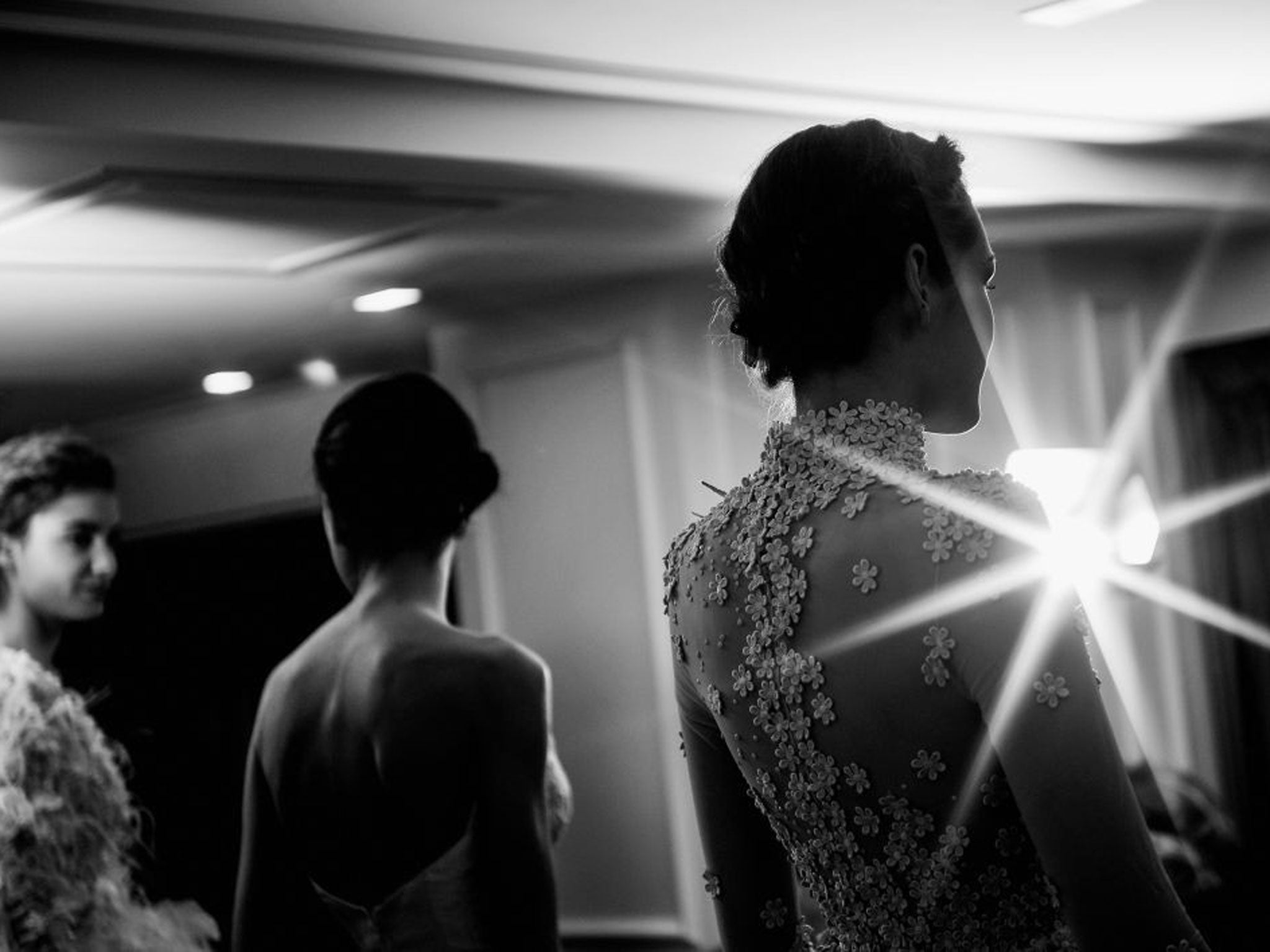 Models prepare for the catwalk before the Tony Yaacoub show as part of Paris Fashion Week Haute-Couture Spring/Summer 2014 at the W Hotel