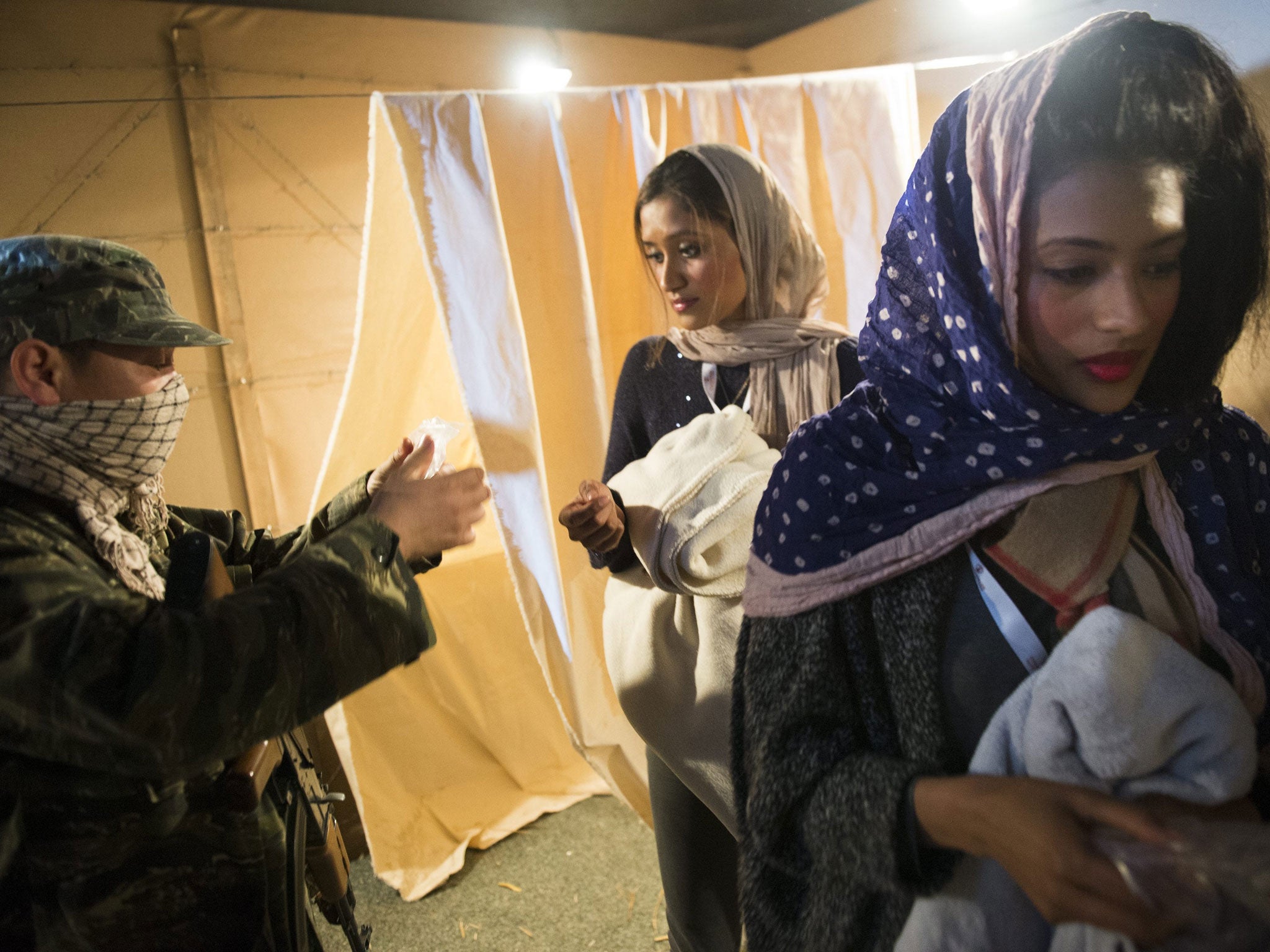 People take part in a simulation entitled 'A Day in the Life of a Refugee: Exploring Solutions for Syria'