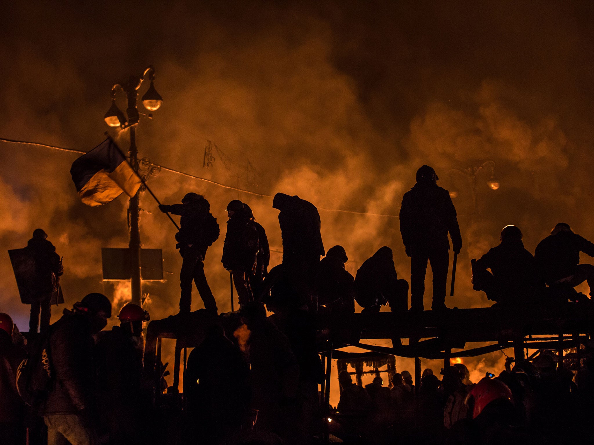 Anti-government protesters clash with policemen in Kiev on Friday night as the protests continue in Ukraine