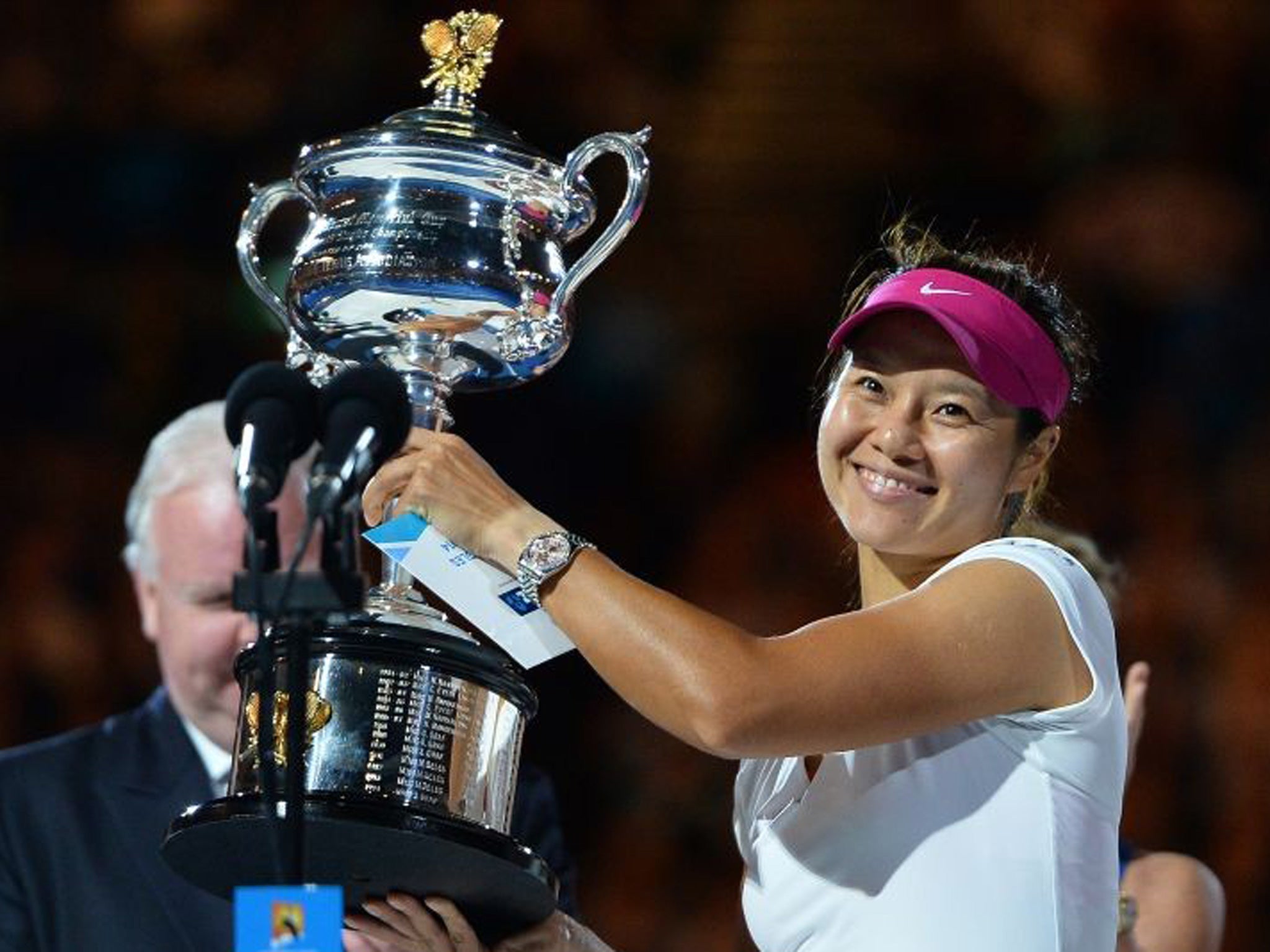 China's Li Na poses with the trophy after her victory against Slovakia's Dominika Cibulkova during the women's singles final at the 2014 Australian Open tennis tournament in Melbourne