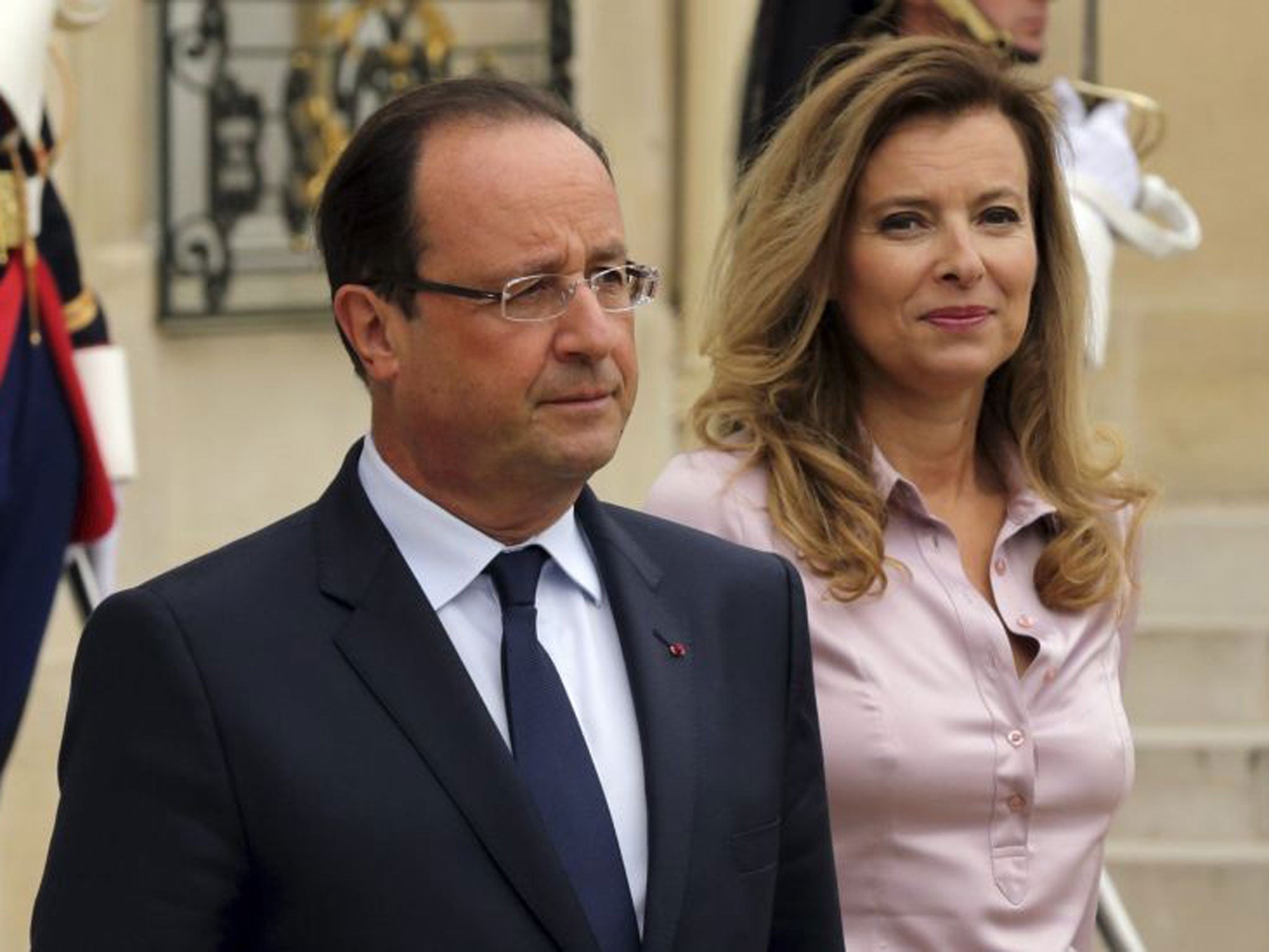 October, 2013: French President Francois Hollande and first lady Valerie Trierweiler accompany guests following a meeting at the Elysee Palace