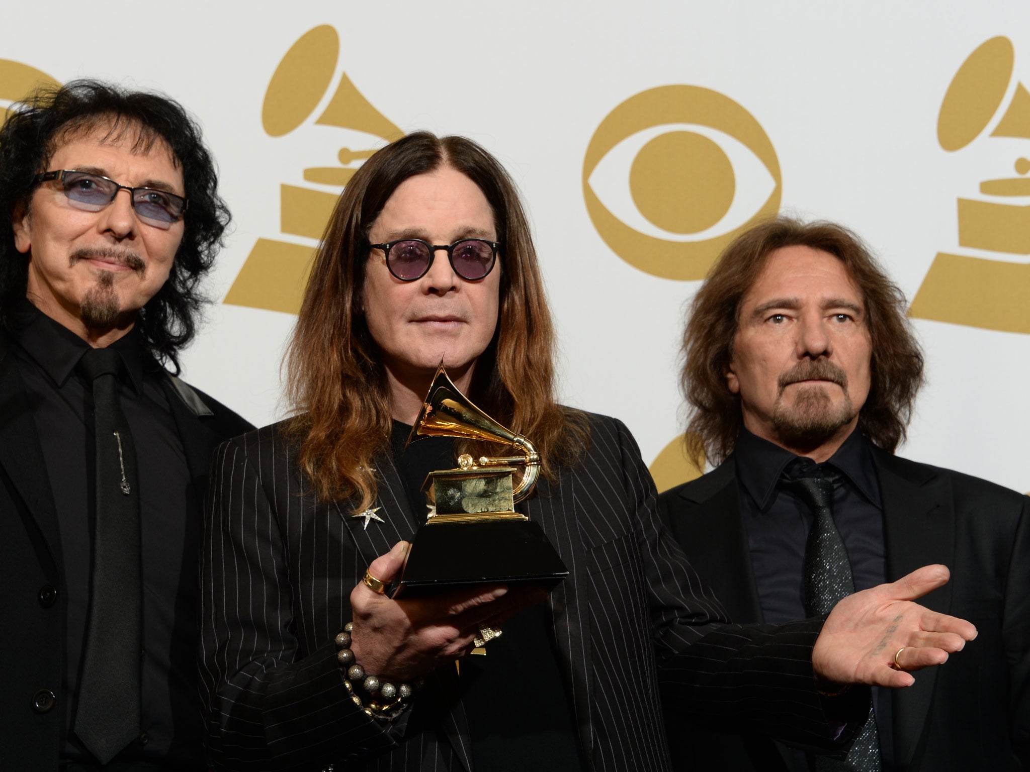 Ozzy Osborne with Black Sabbath's Grammy Award for Hard Rock/Metal Performance with God Is Dead