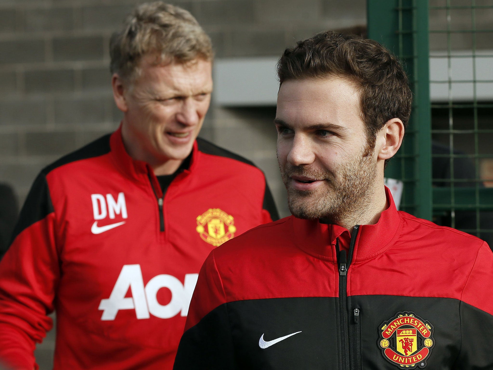 Juan Mata (right) and David Moyes arrive at Carrington training complex on Monday