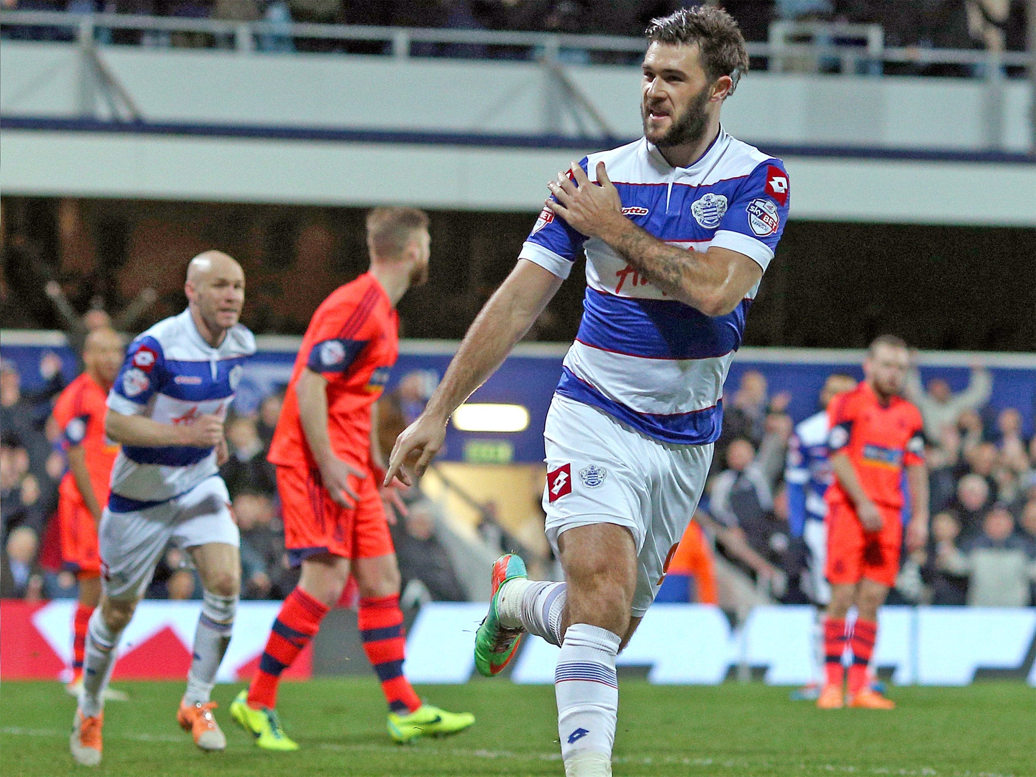 QPR’s Charlie Austin celebrates scoring the opener in the 2-0 win over Bolton