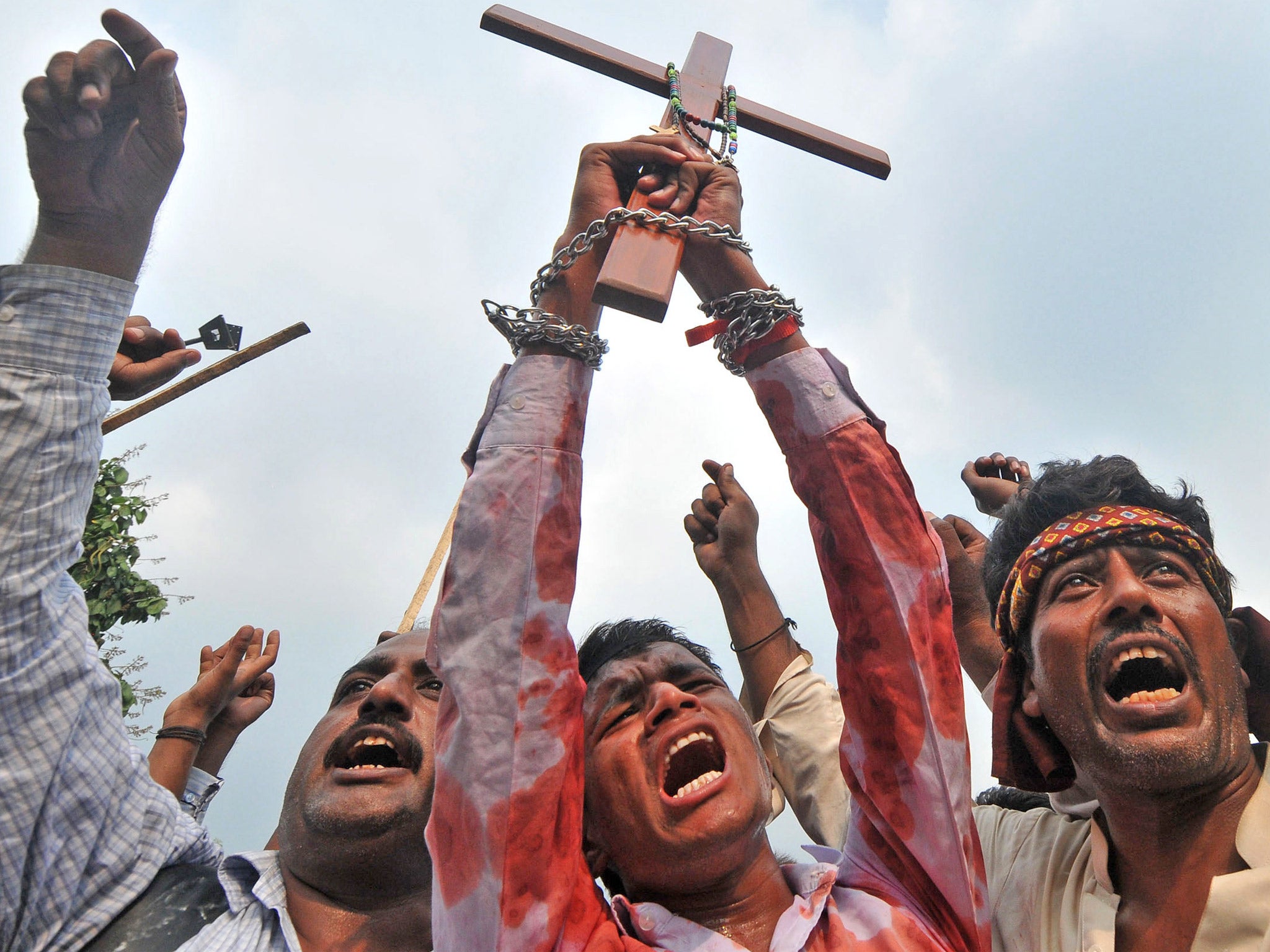 Cross to bear: Pakistani Christians protest in Lahore after the suicide bombing of a church in Peshawar