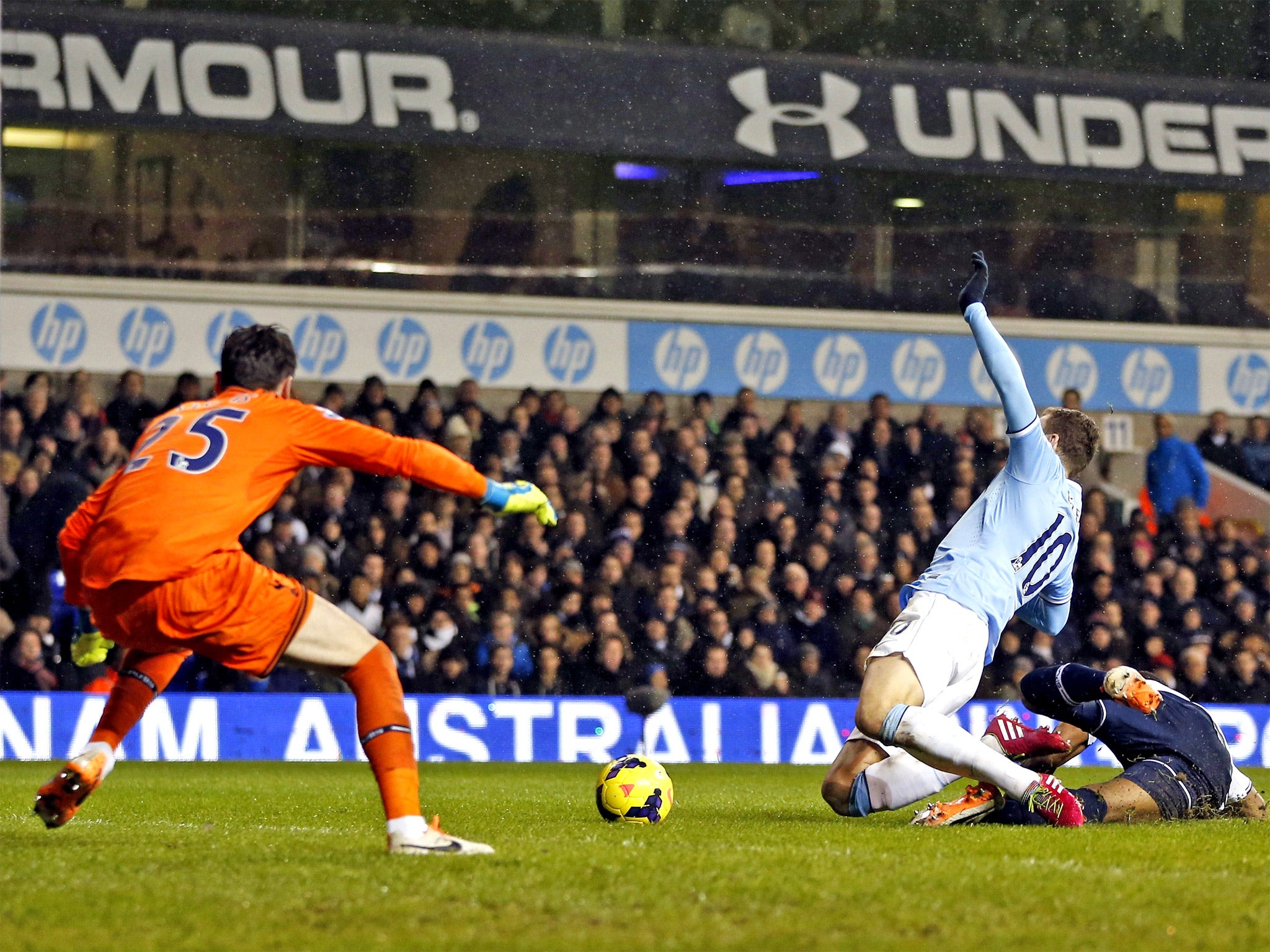 Edin Dzeko earns a penalty despite Tottenham defender Danny Rose winning the ball