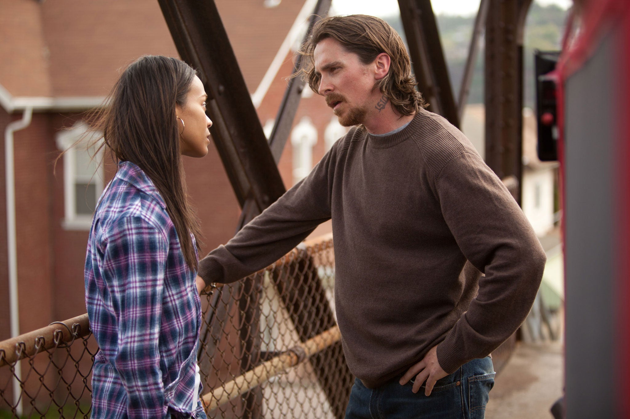 Christian Bale and Zoe Saldana in Out Of The Furnace