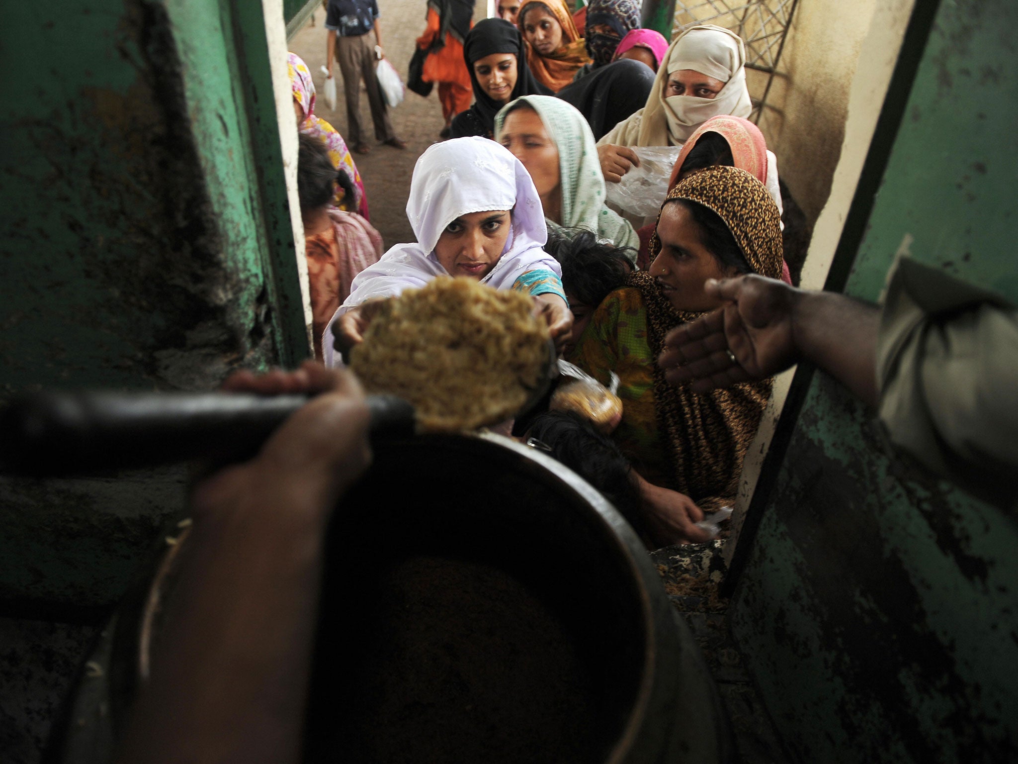 Rice is the staple diet in many of the poorest countries in the world. Dr Moore argues that a GM crop could solve the problem of vitamin A deficiency among children (AFP/Getty Images)