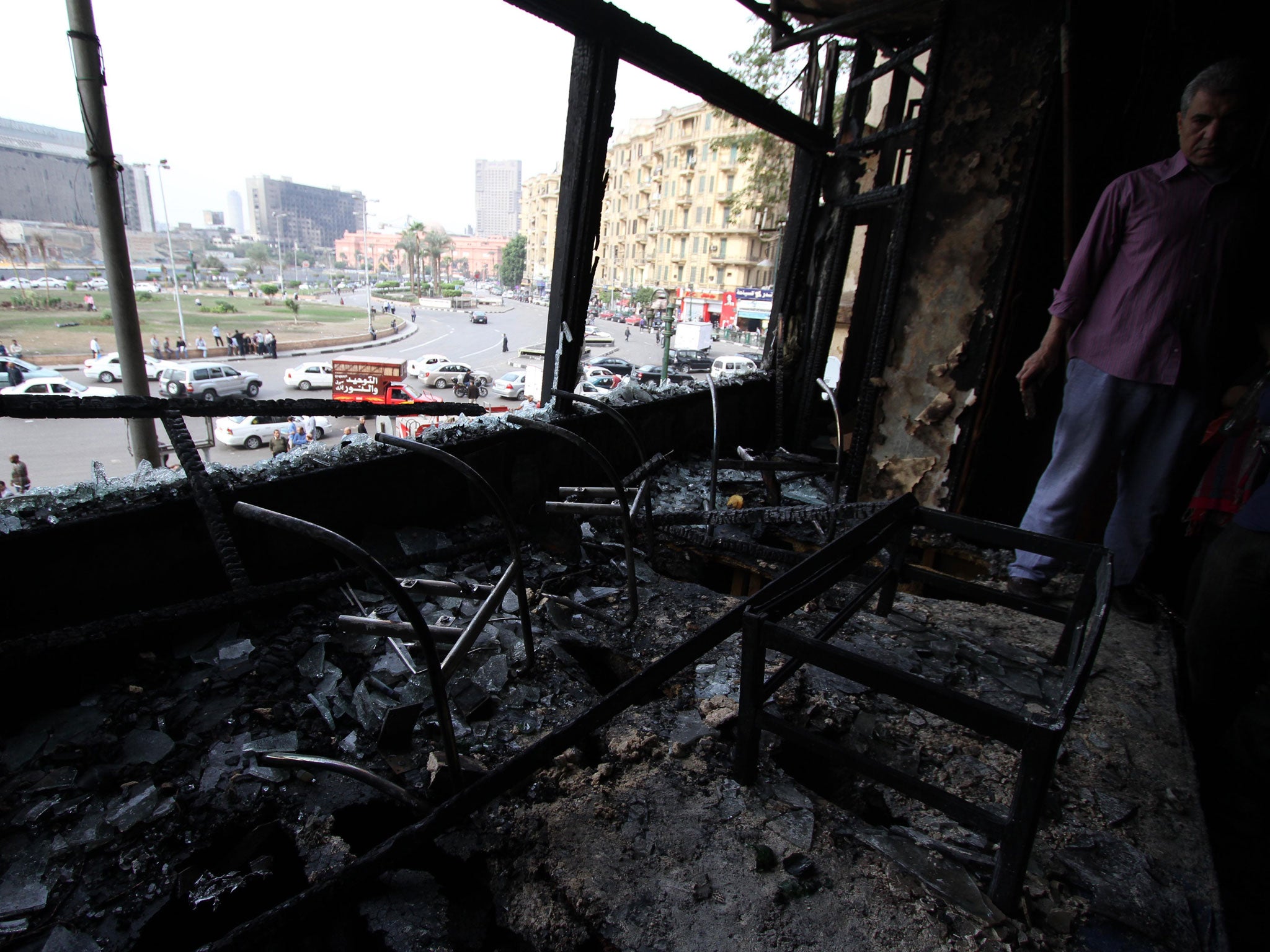 The fire-bombed offices of Al Jazeera in Cairo in November 2012. The Qatari satellite news channel was, to many, a biased supporter of the Muslim Brotherhood's rise to power