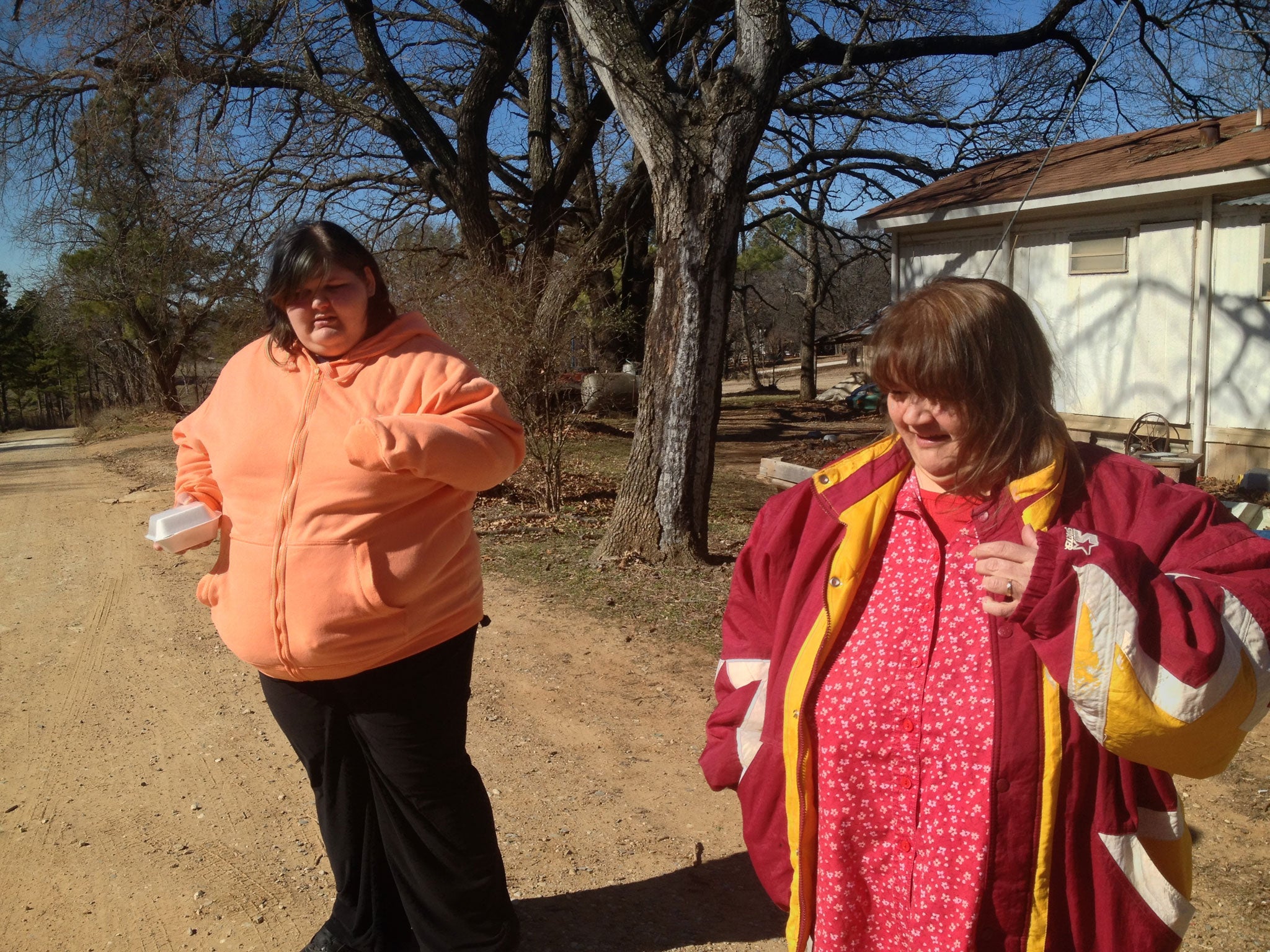 Melinda McQuigg and daughter Breanne by their trailer home