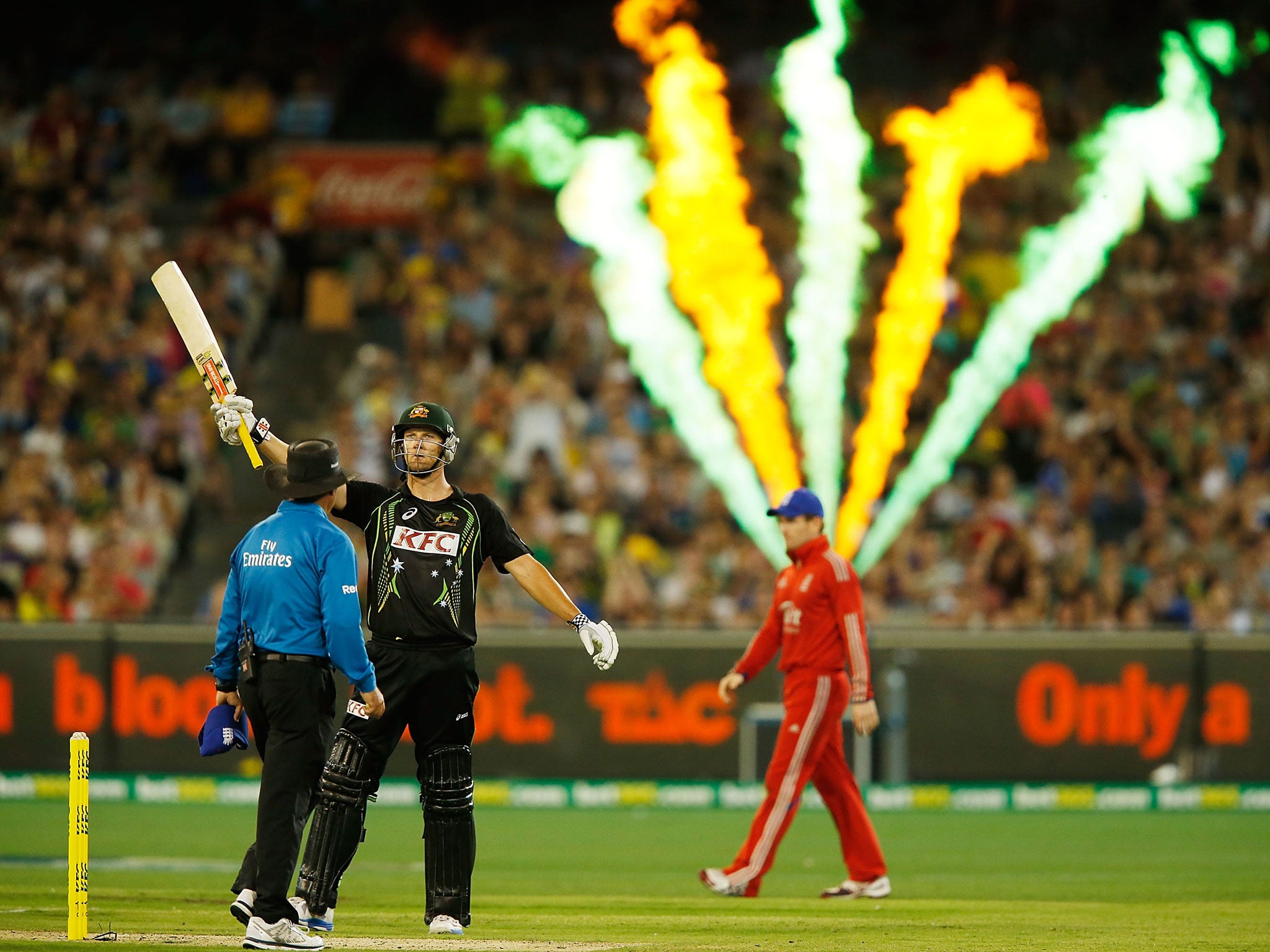 Cameron White of Australia raises his bat after reaching 50 runs during game two of the International Twenty20 series between Australia and England