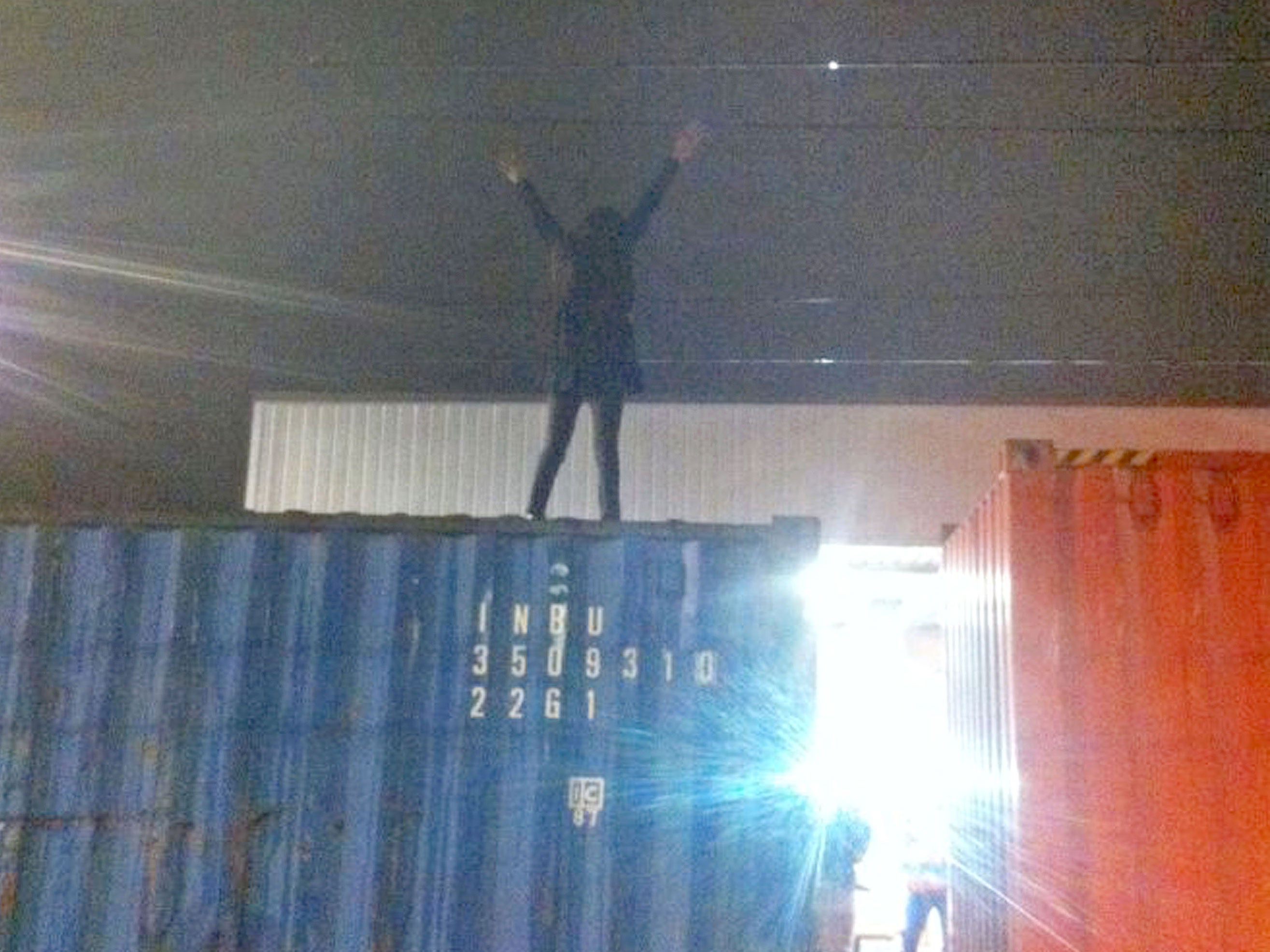 A young woman jumps on a stationary freight train in 'moment of madness' before hitting live overhead cables