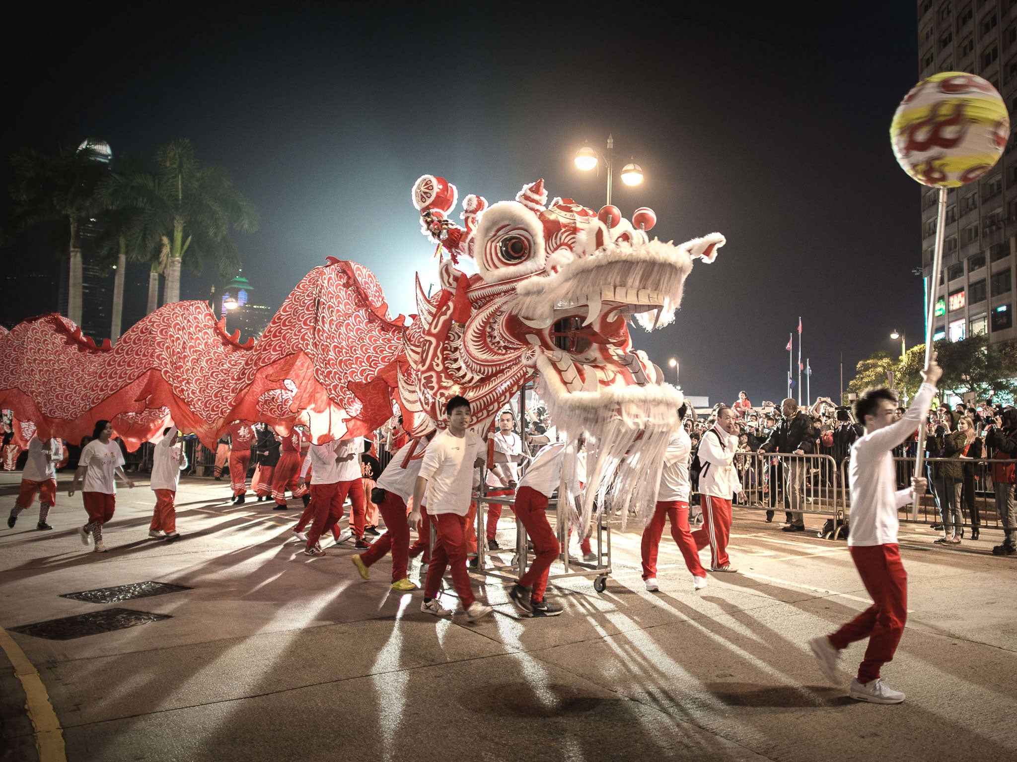 Performers display a dragon dance during a parade in Hong Kong