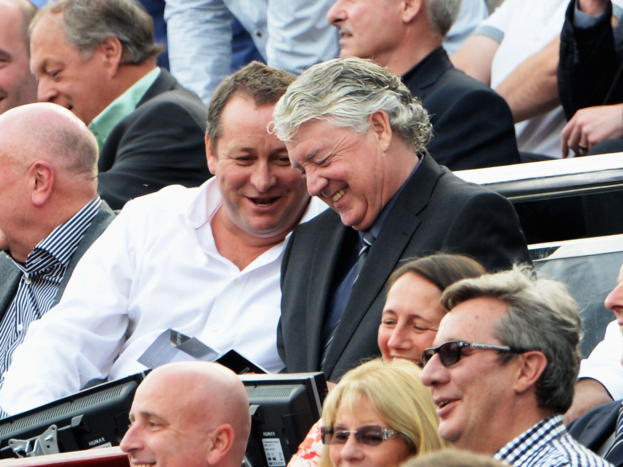 Mike Ashley and Joe Kinnear enjoy their seats at the heart of St James's Park