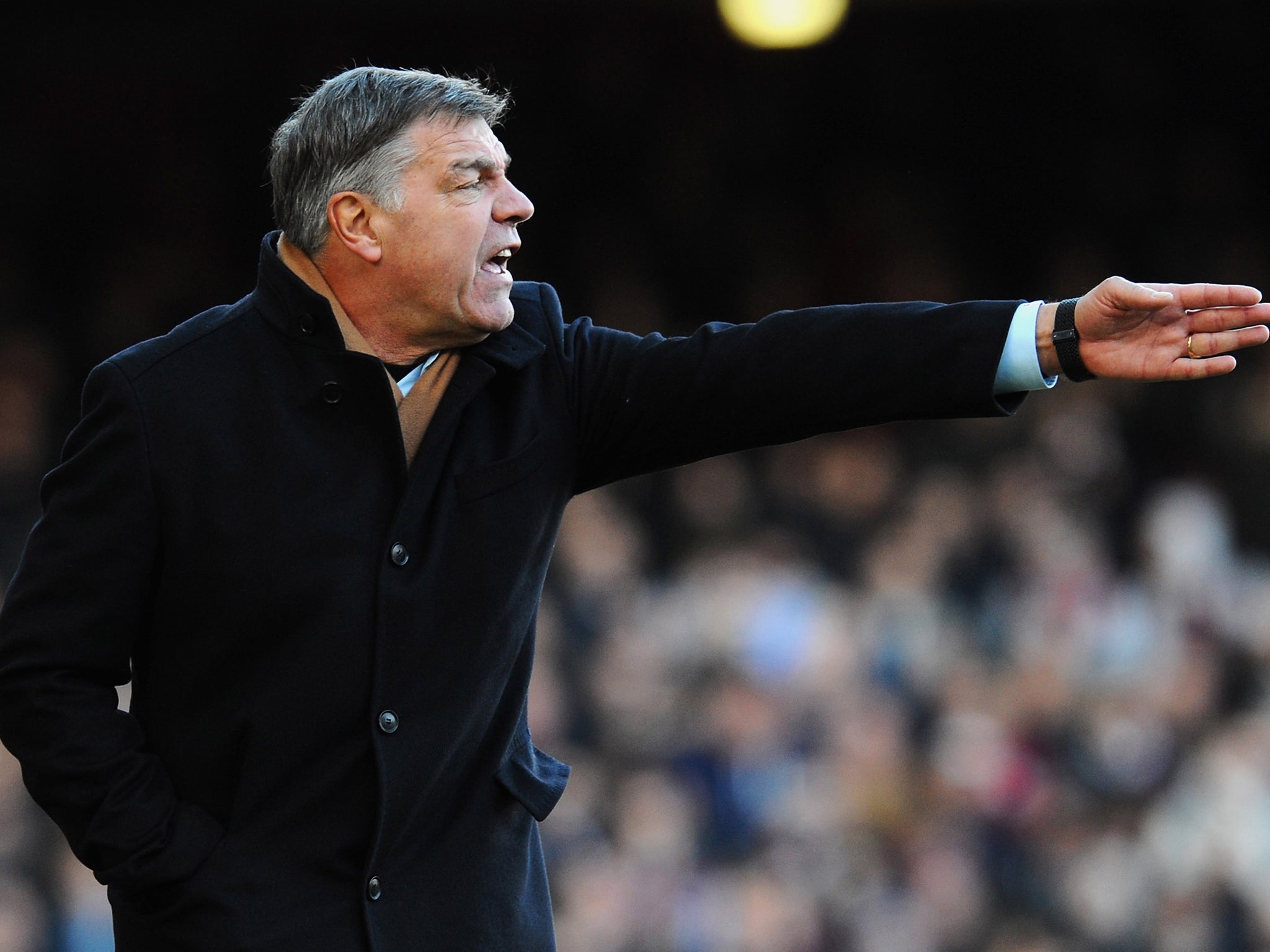 Sam Allardyce makes a gesture form the sidelines