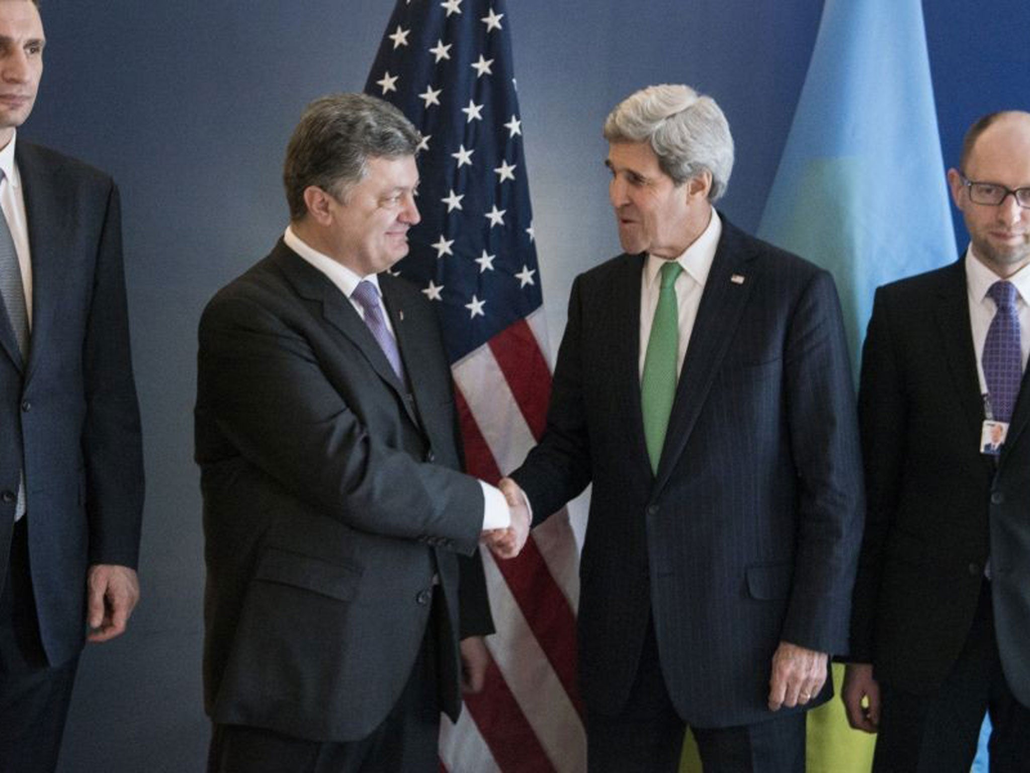 Ukrainian politician Petro Poroshenko (left) with John Kerry yesterday