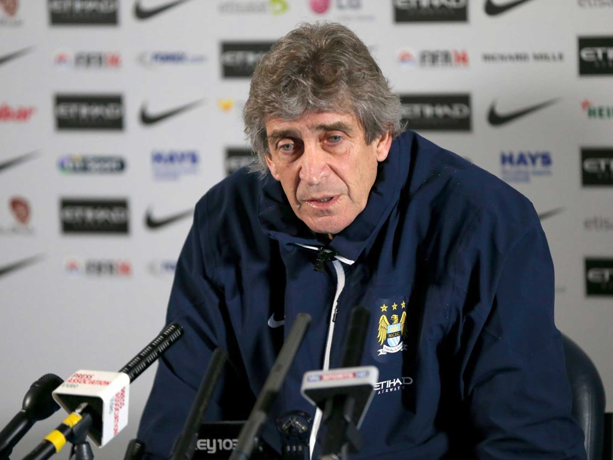 Manchester City manager Manuel Pellegrini speaks to the media