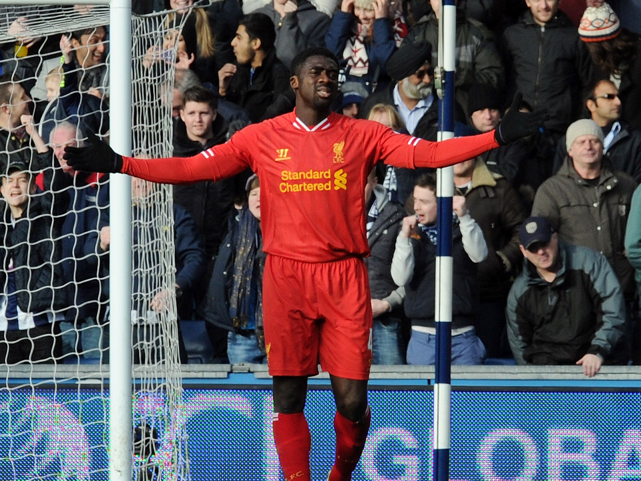Liverpool defender Kolo Toure is dejected after his error led to West Brom's equaliser