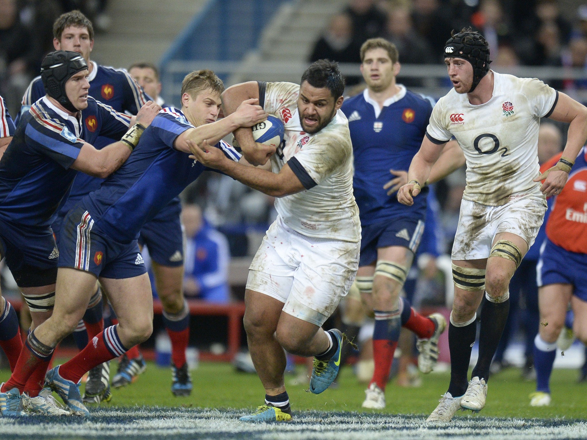 The outstanding Billy Vunipola of England shrugs off the challenge of the French defence during the Six Nations match at the Stade de France