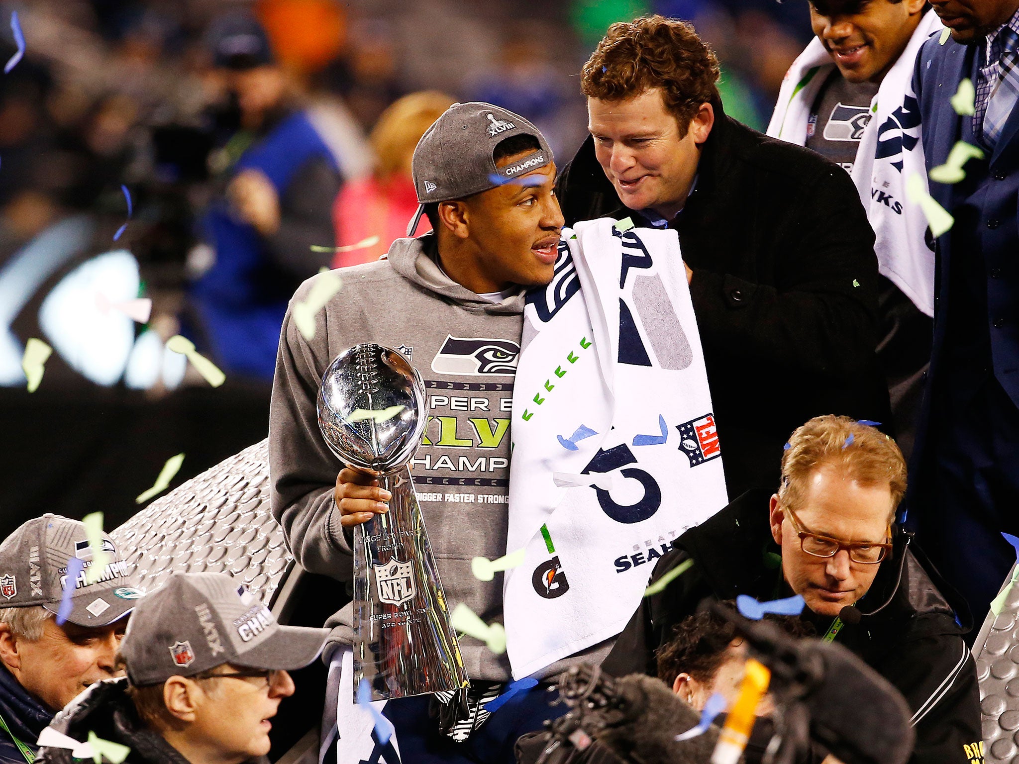 Malcolm Smith holds the Super Bowl trophy after he was named the MVP during the Seattle Seahawks victory over the Denver Broncos