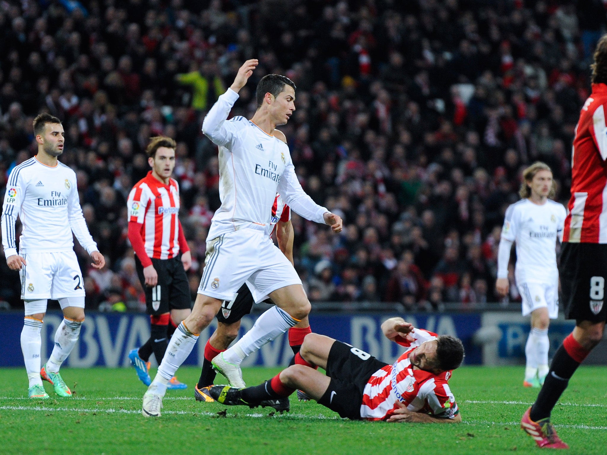 Carlos Gurpegi of Atletico Madrid is is brought down by Cristiano Ronaldo of Real Madrid - leading to a red card for the Ballon d'Or holder