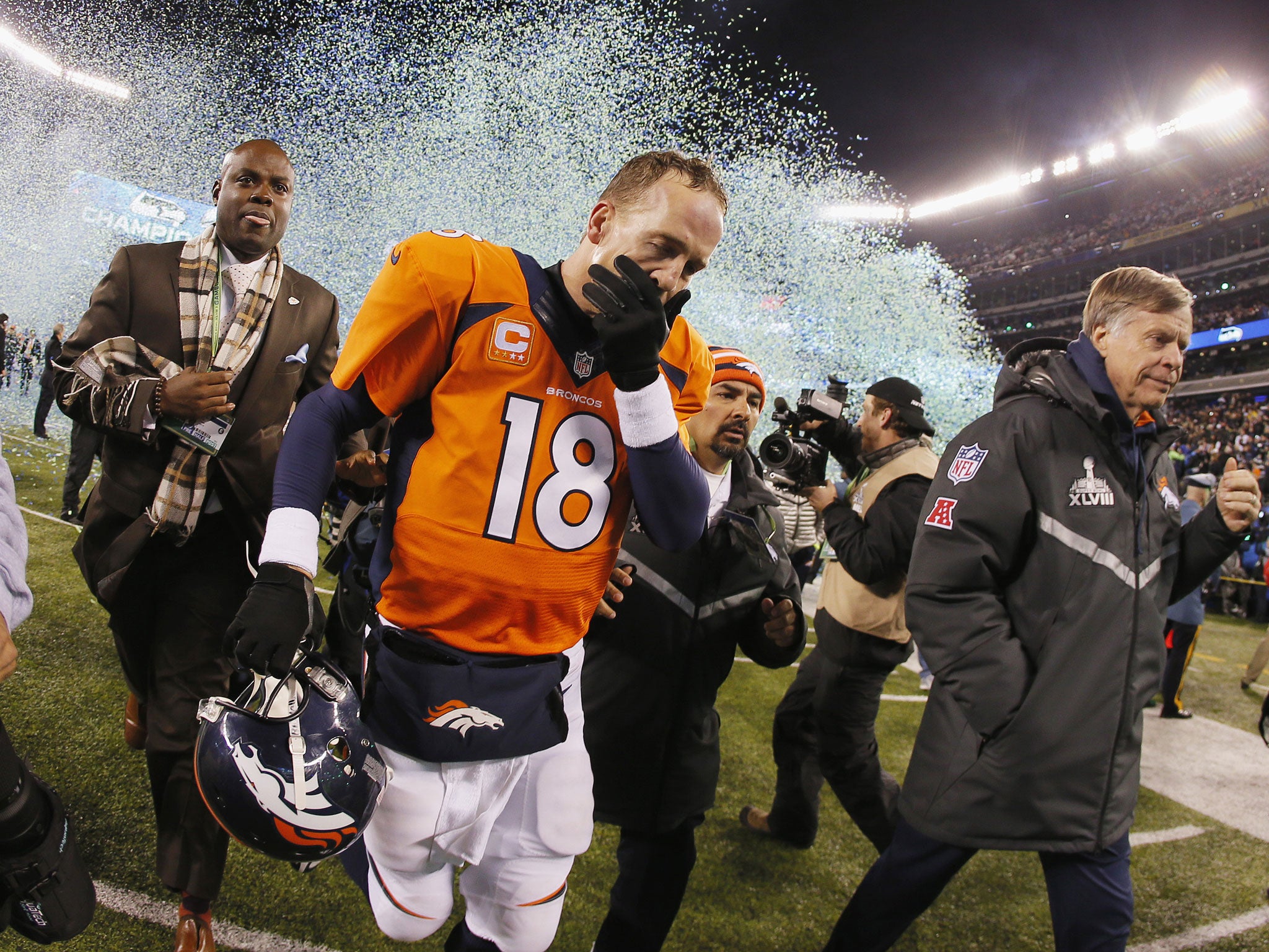 Quarterback Peyton Manning #18 of the Denver Broncos reacts as he walks off the field after their 43-8 loss to the Seattle Seahawks