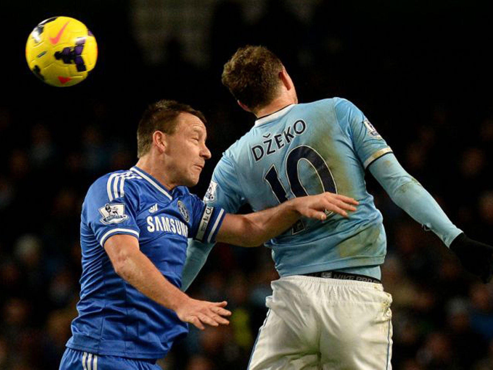 John Terry pictured challenge Edin Dzeko in the sides' recent meeting