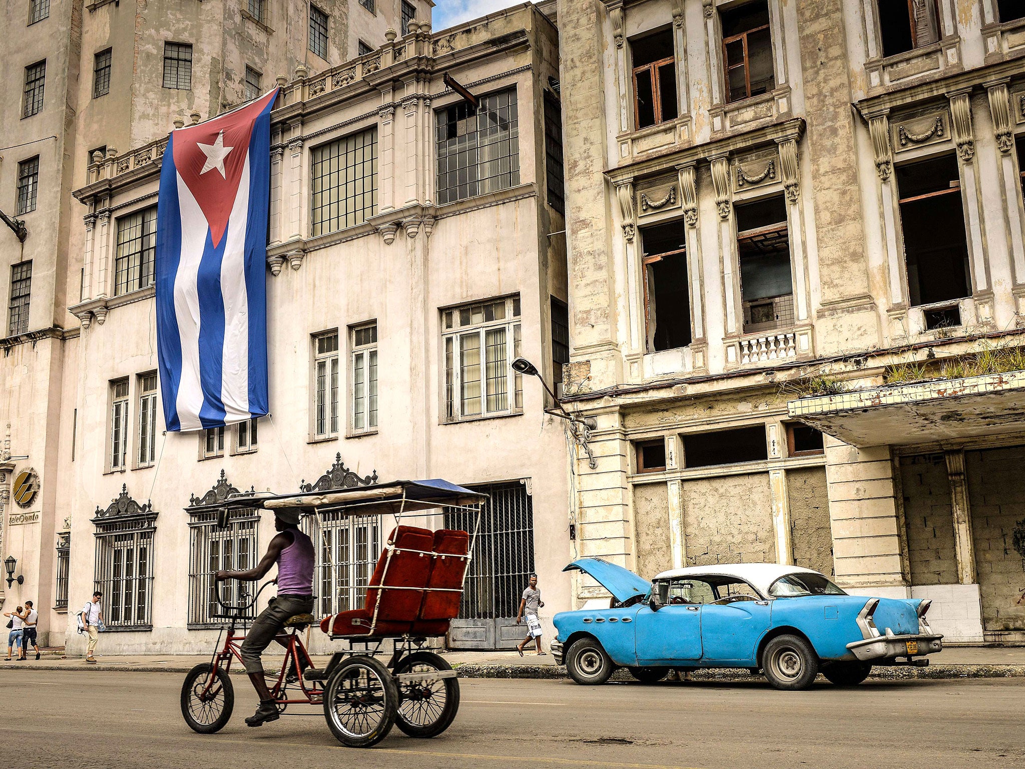 A Cuban flag hangs from a building in the country's capital Havana