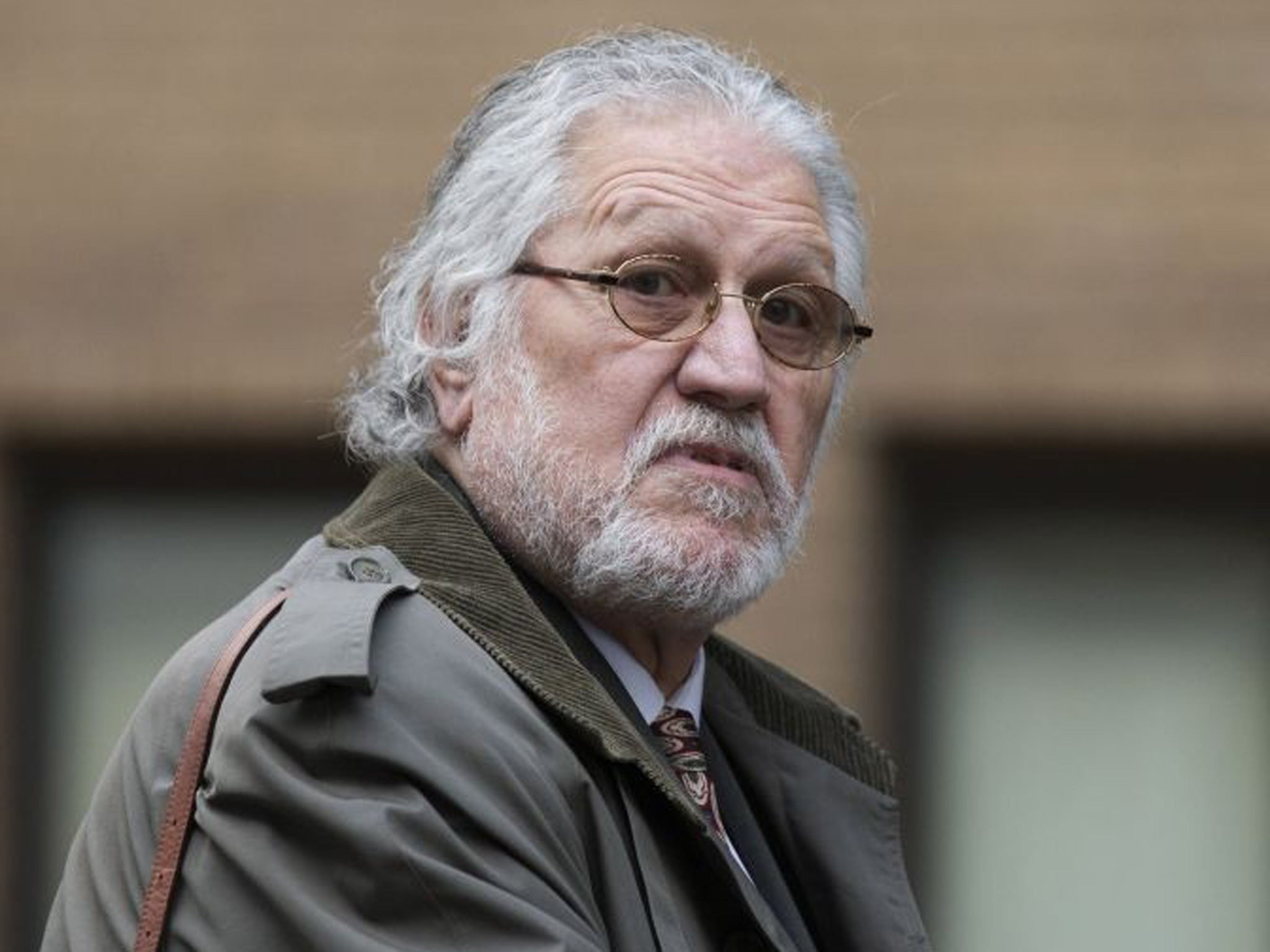 Radio presenter Dave Lee Travis arrives at Southwark Crown Court on 5 February 2014