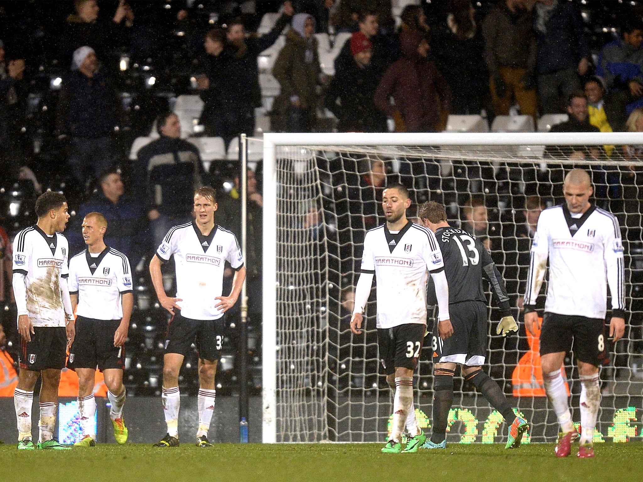 Fulham players are left dejected following Sheffield United’s late winner in Tuesday’s FA Cup tie