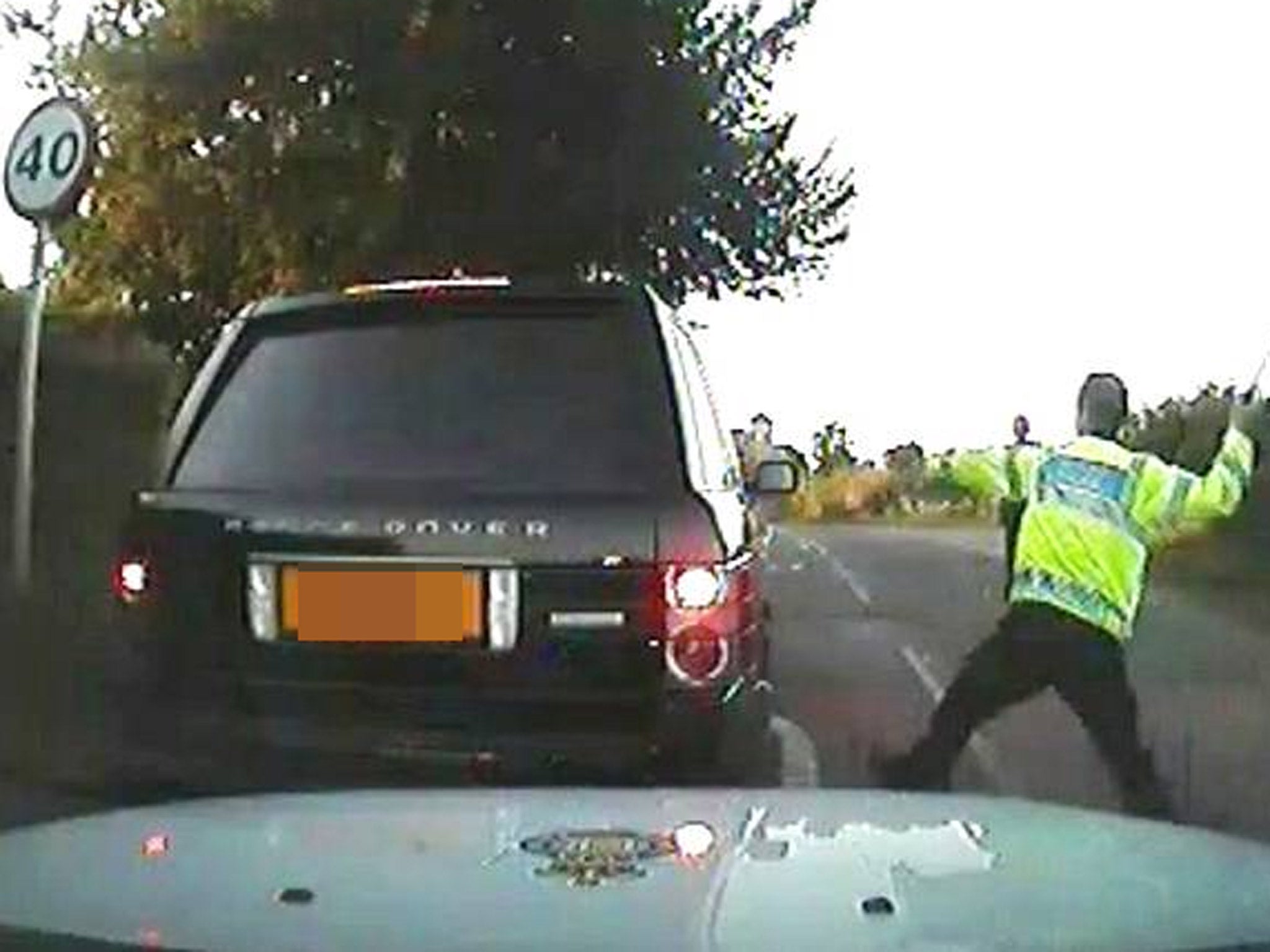 Former Gwent PC Mike Baillon smashes the window of Mr Whatley's vehicle