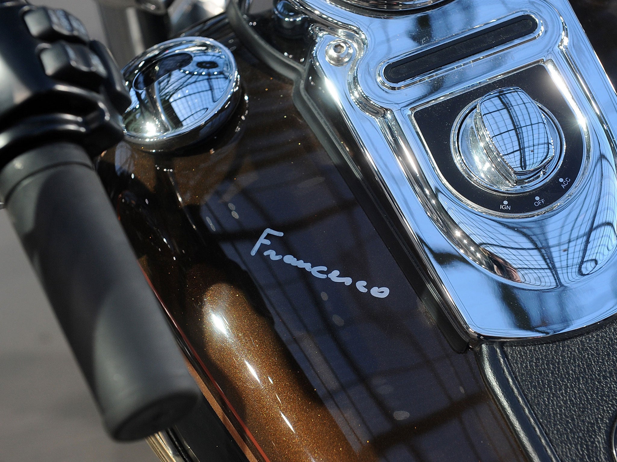 Pope Francis signature is seen on the tank of a 2013 Harley Davidson 1 585 cm3 Dyna Super Glide Custom.