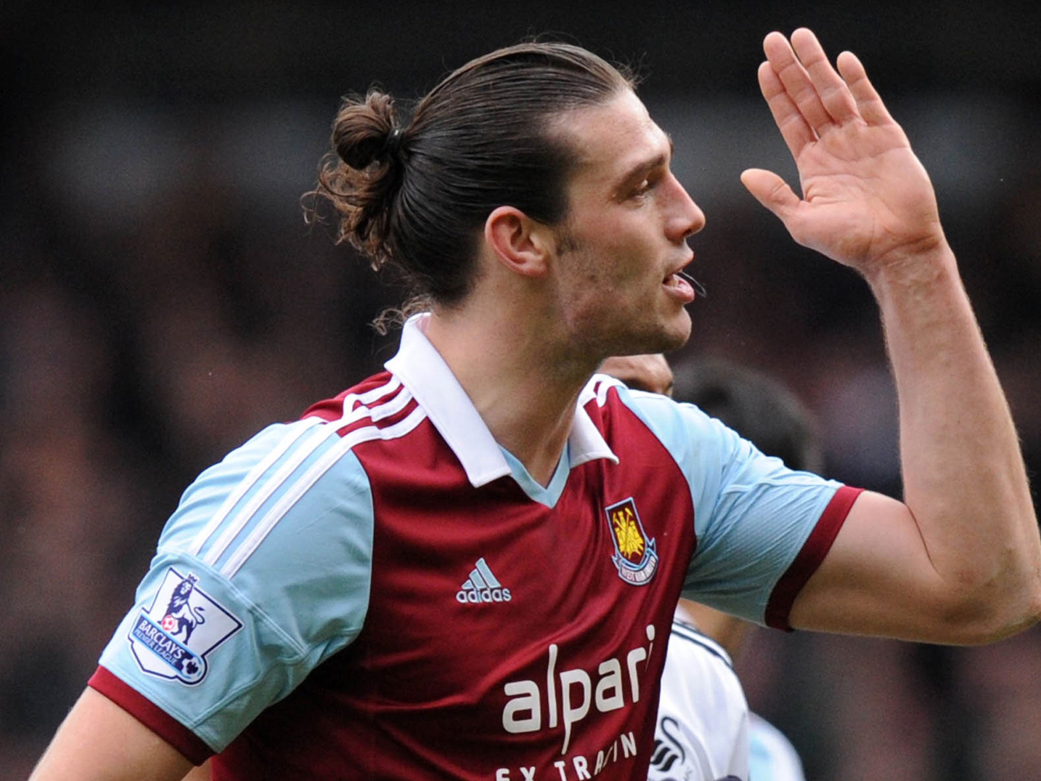 Andy Carrol reacts after he was sent off after clashing with Swansea's Chico Flores earlier this season