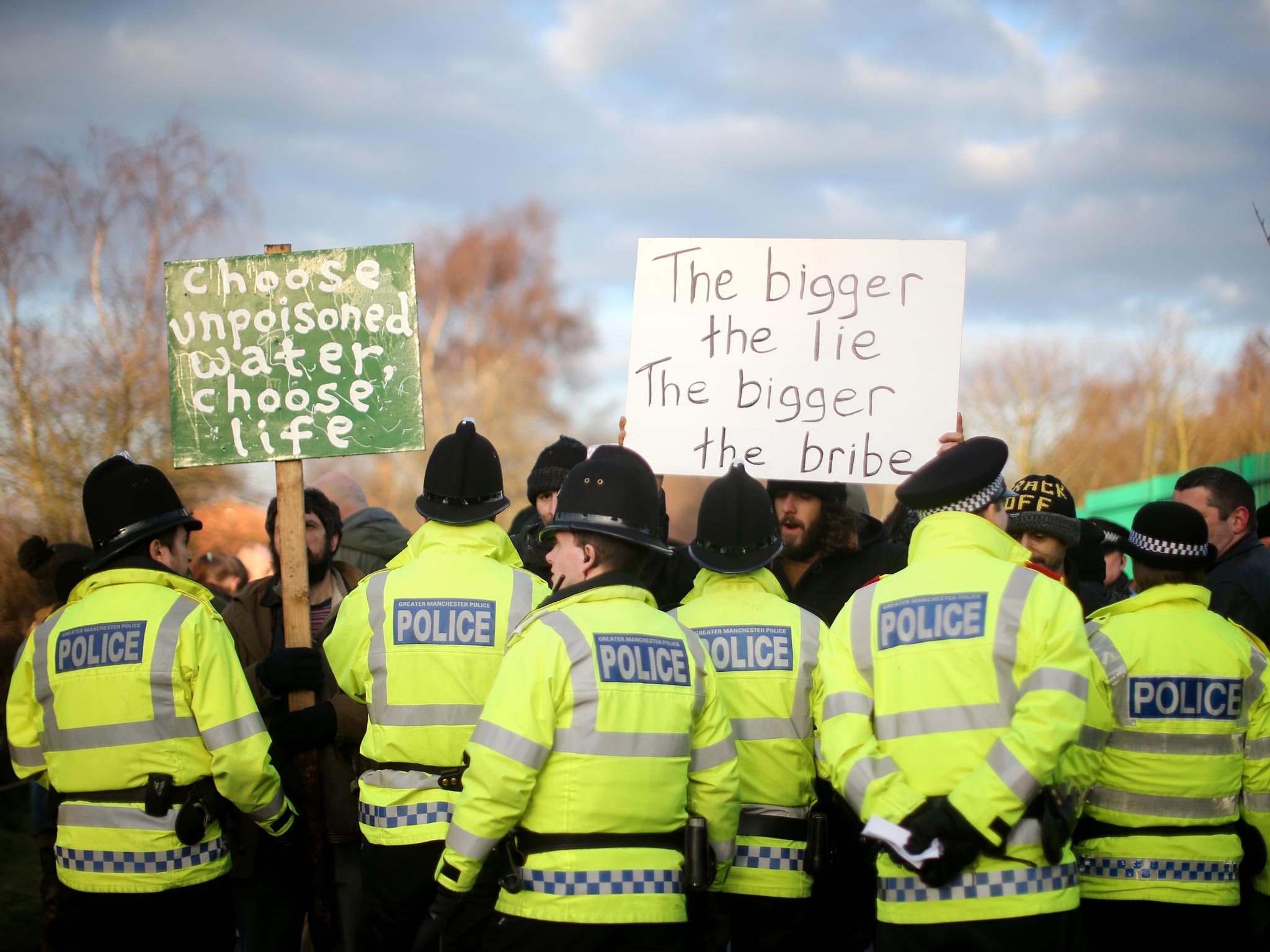 Anti-fracking protestors try to stop trucks carrying chemicals to the Barton Moss gas fracking facility