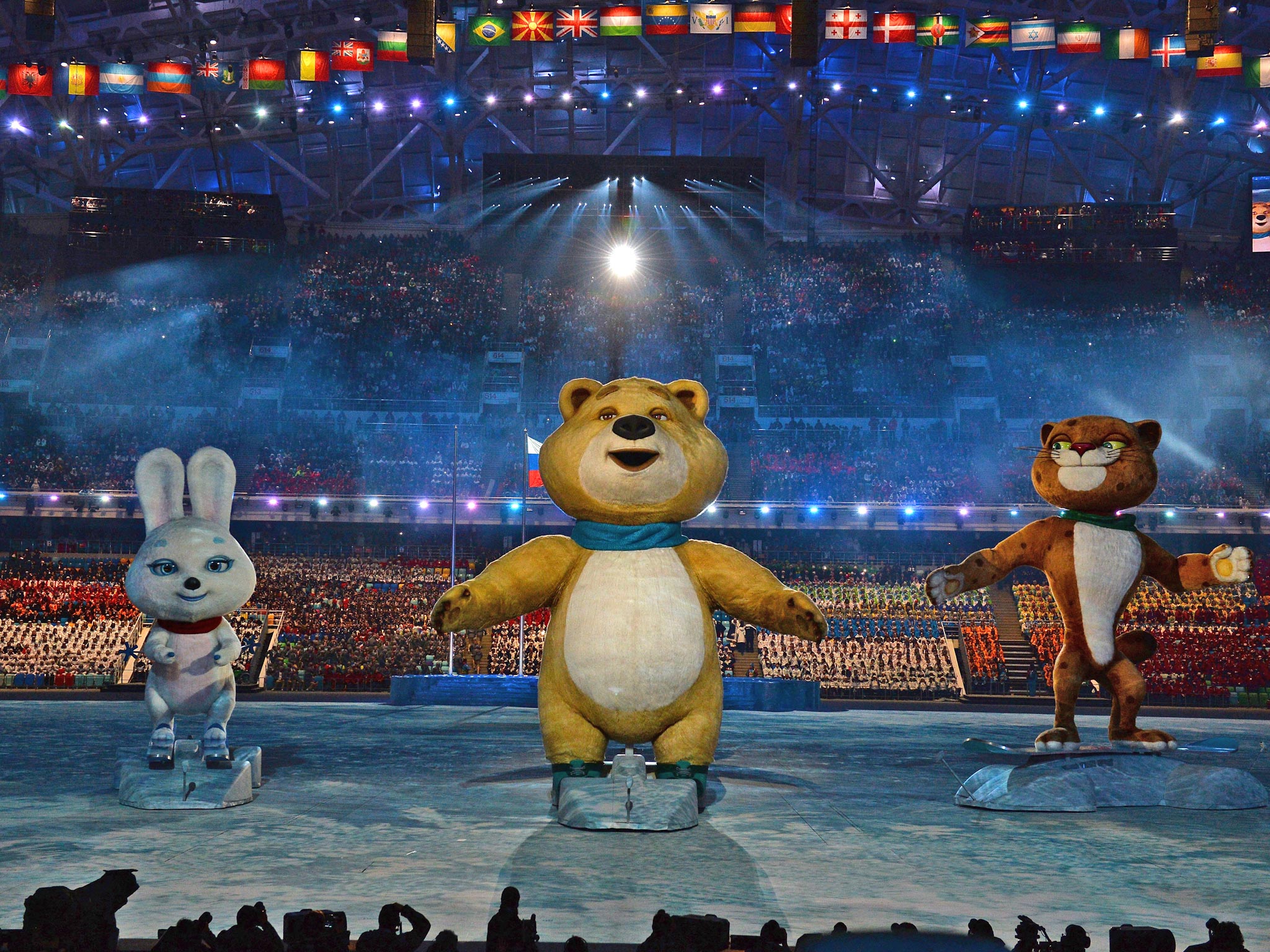 The Winter Olympic mascots the Hare, the Polar Bear and the Leopard loom large above the arena