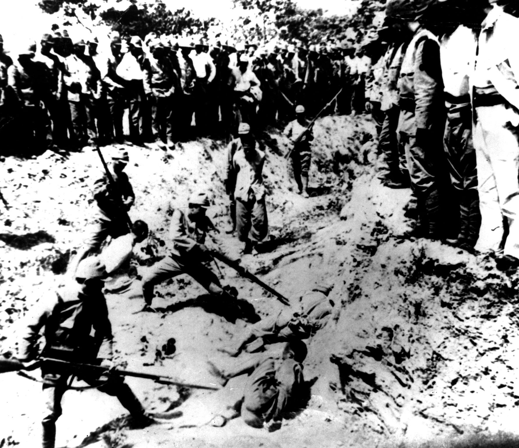 Japanese recruits at bayonet drill using Chinese prisoners as targets, after the capture of the Chinese capital, Nanjing, in 1937