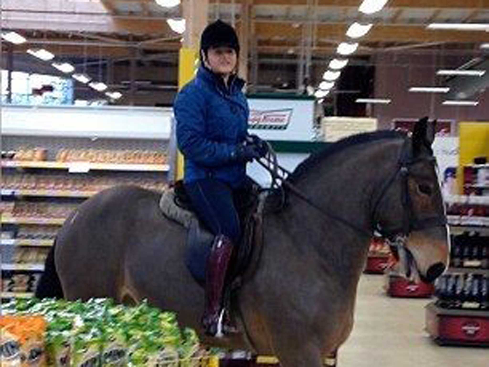 A Durham woman rides a horse into a local supermarket for her neknomination