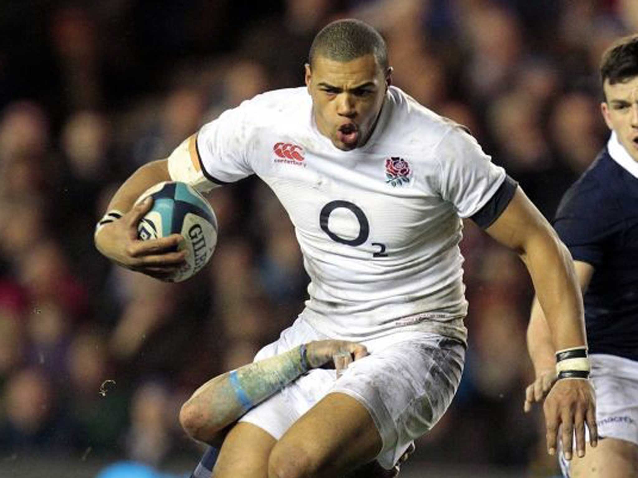 Luther Burrell, who scored his second try in as many matches, leaves Sean Lamont grounded as he powers through