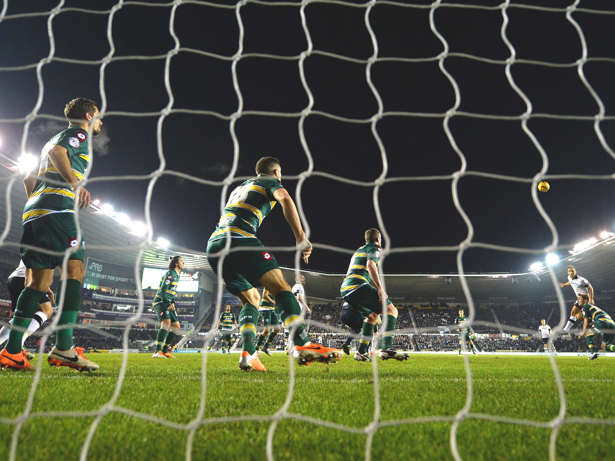 John Eustace of Derby County heads home the opening goal during the Sky Bet Championship match between Derby County and Queens Park Rangers