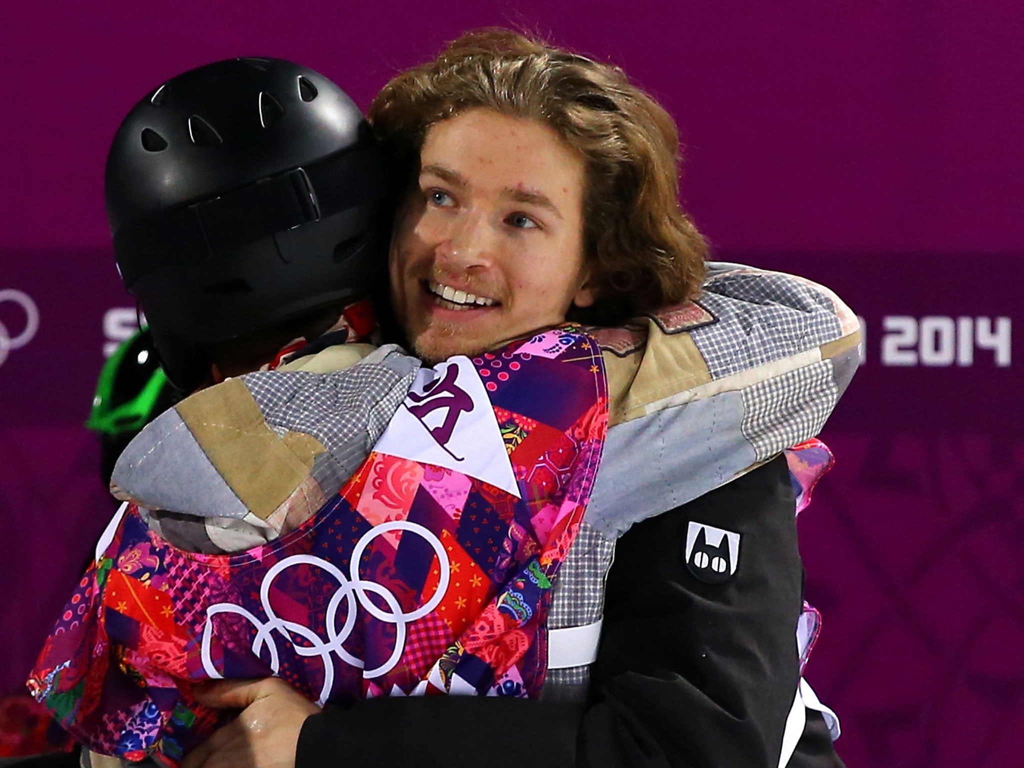 Shaun White of the United States congratulates gold medalist Iouri Podladtchikov of Switzerland