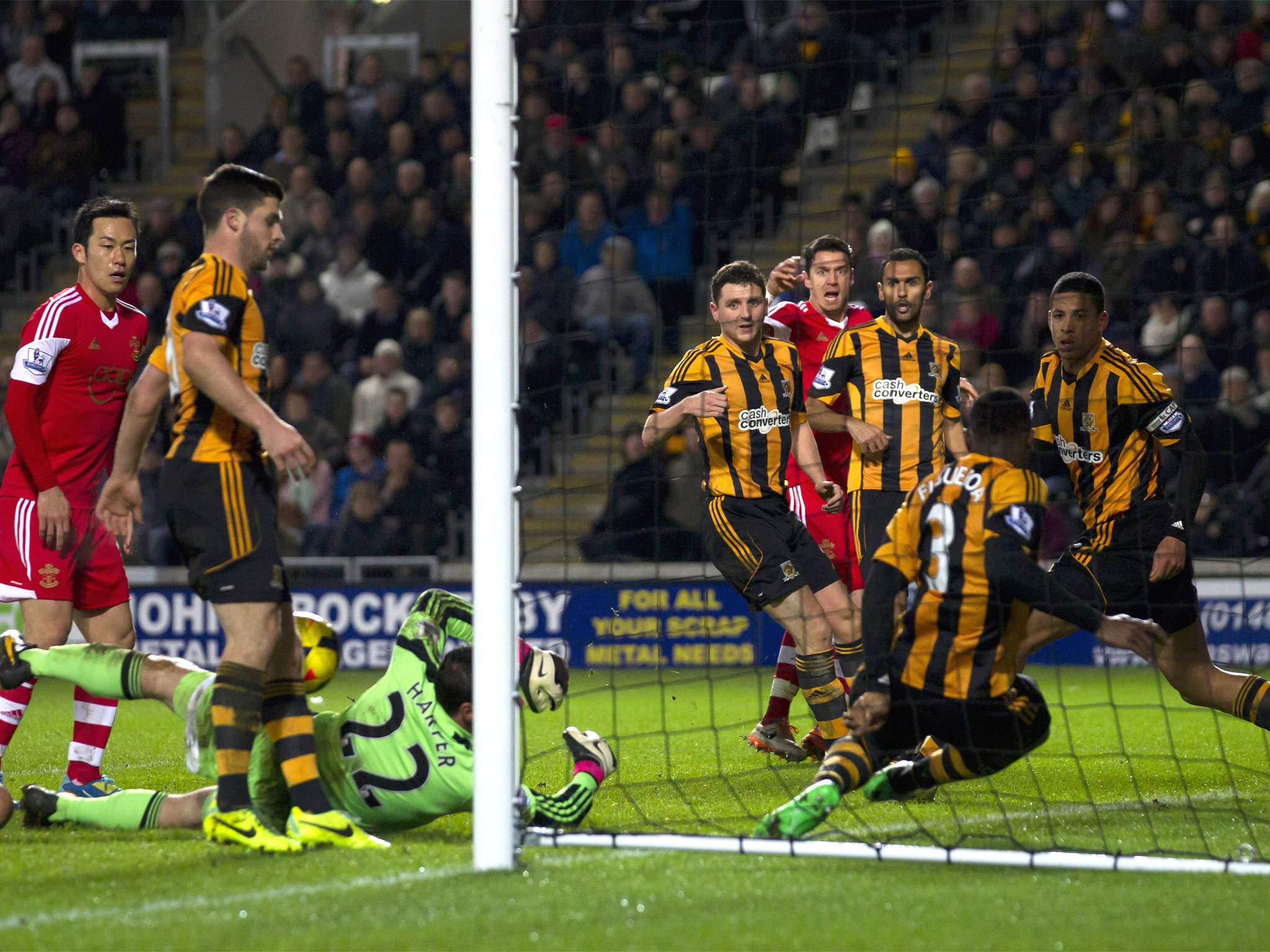 José Fonte (middle in red) watches as his effort creeps over the line