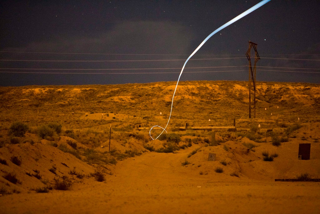 A light trail is seen from Lockheed Martin's prototype 'self guiding bullet'.