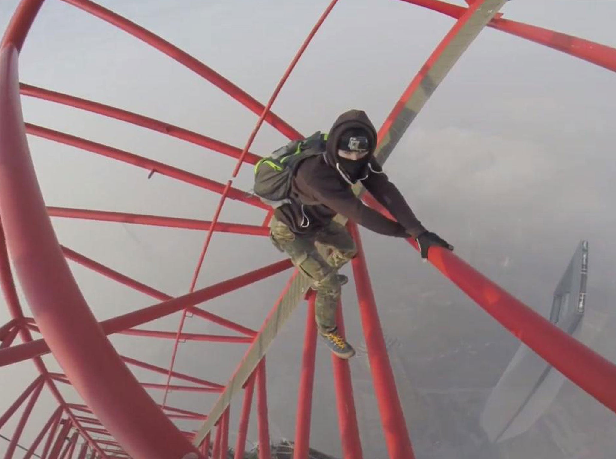 One of the men as they scale the building