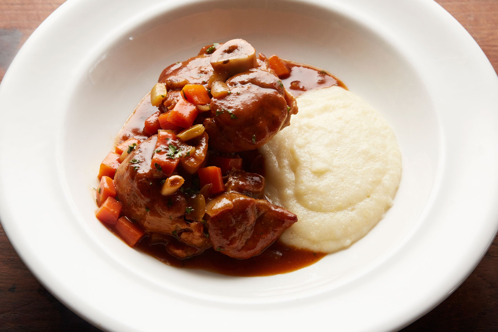 Serve Pork Osso bucco with creamed polenta or mashed potato