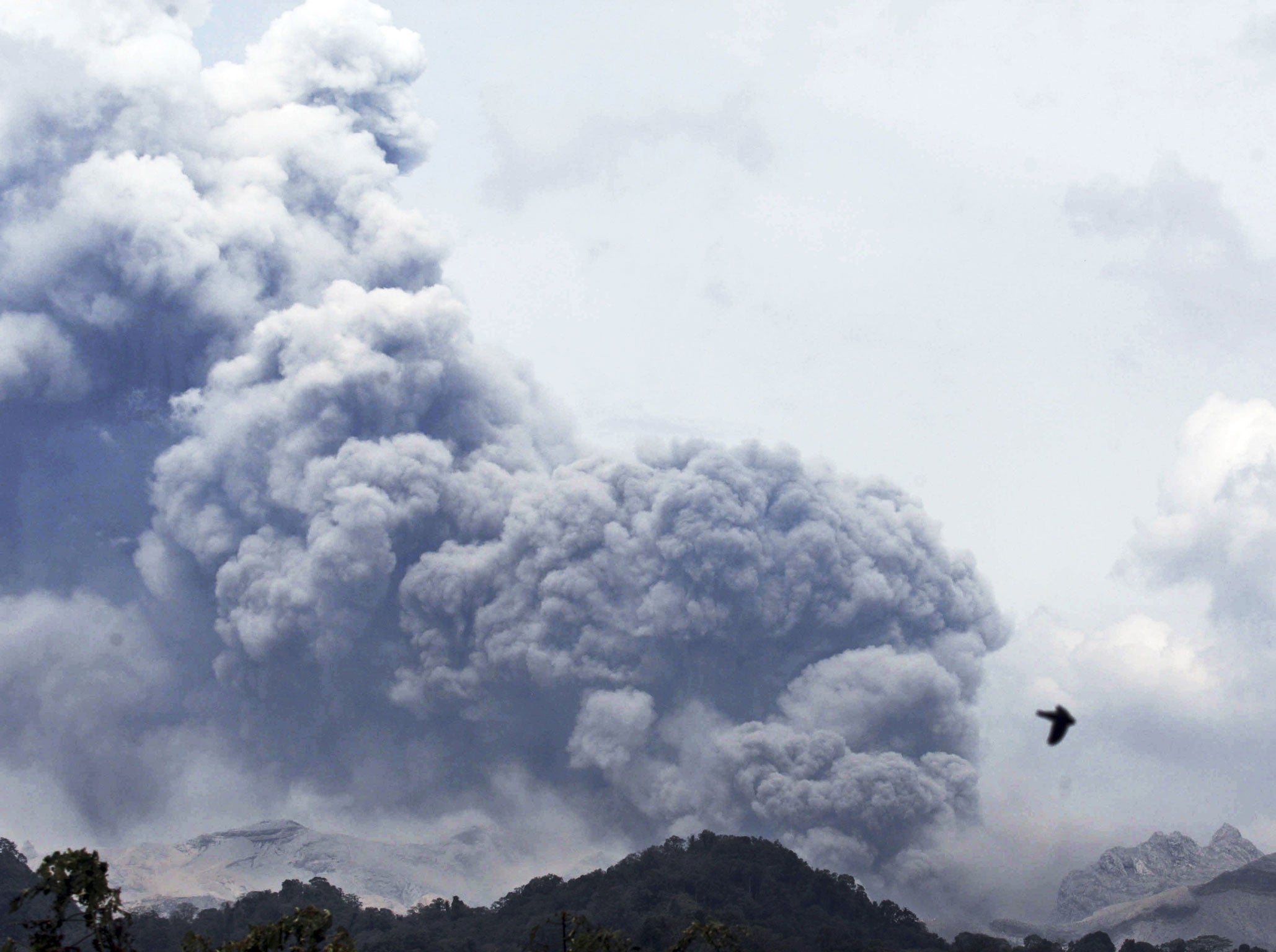 Mount Kelud erupts, as seen from Anyar village in Blitar, East Java, Indonesia, Friday, 14 Feb 2014.