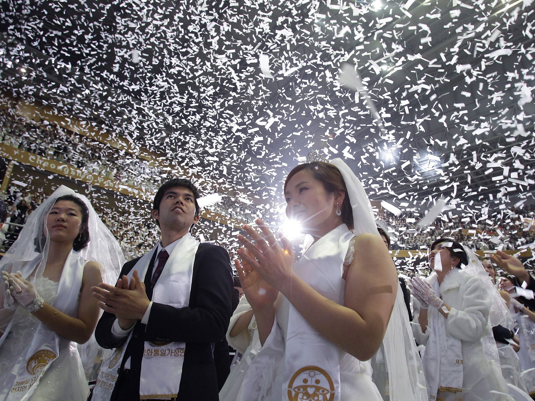 Couples take part in a mass wedding ceremony at Cheongshim Peace World Center in Gapyeong-gun