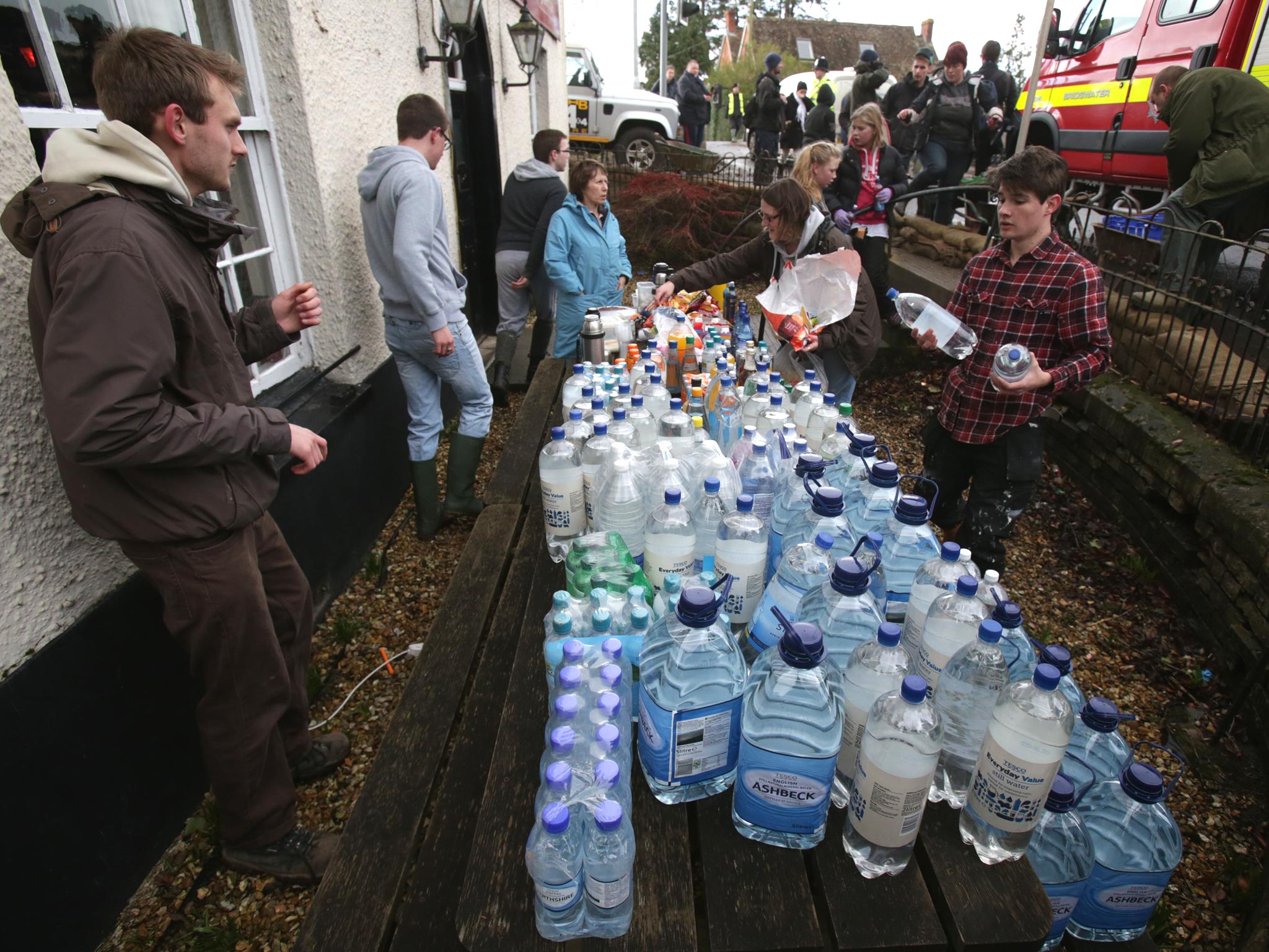 Volunteers arrive with donations at the King Alfred Inn at Burrowbridge on the Somerset Levels